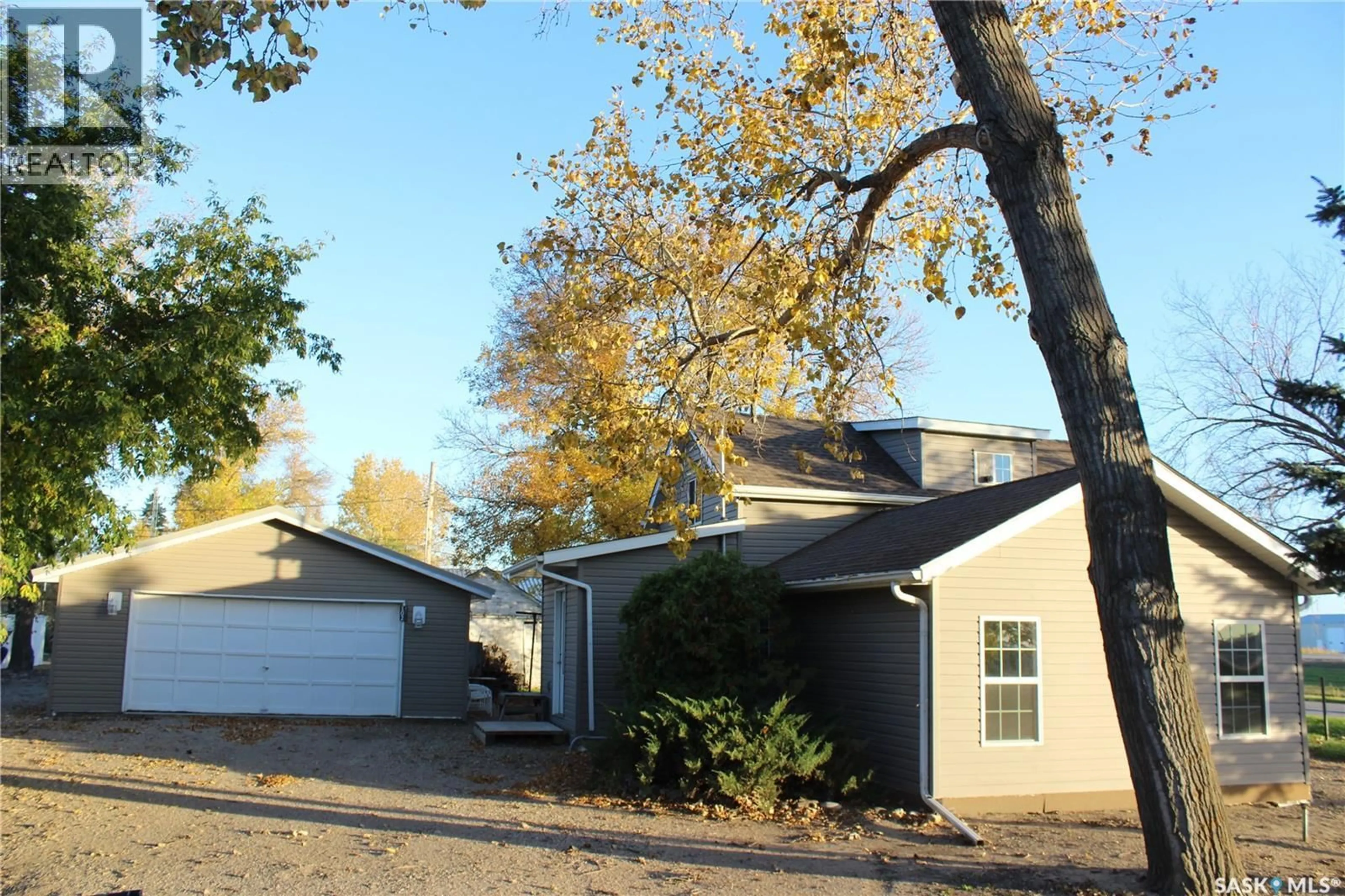 Home with vinyl exterior material, street for 102 MAINPRIZE STREET, Midale Saskatchewan S0C1S0
