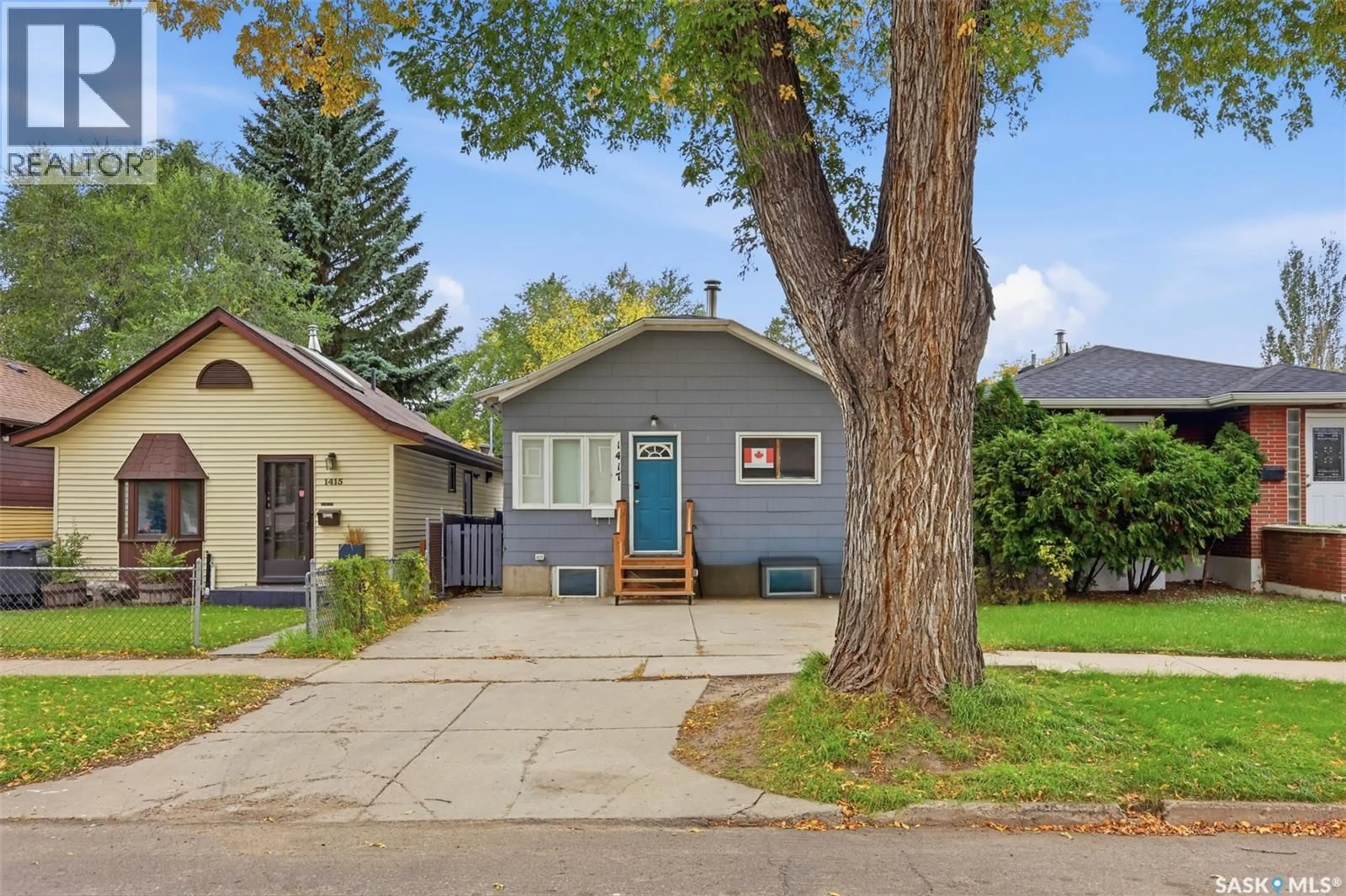Home with vinyl exterior material, street for 1417 G AVENUE, Saskatoon Saskatchewan S7L2A8