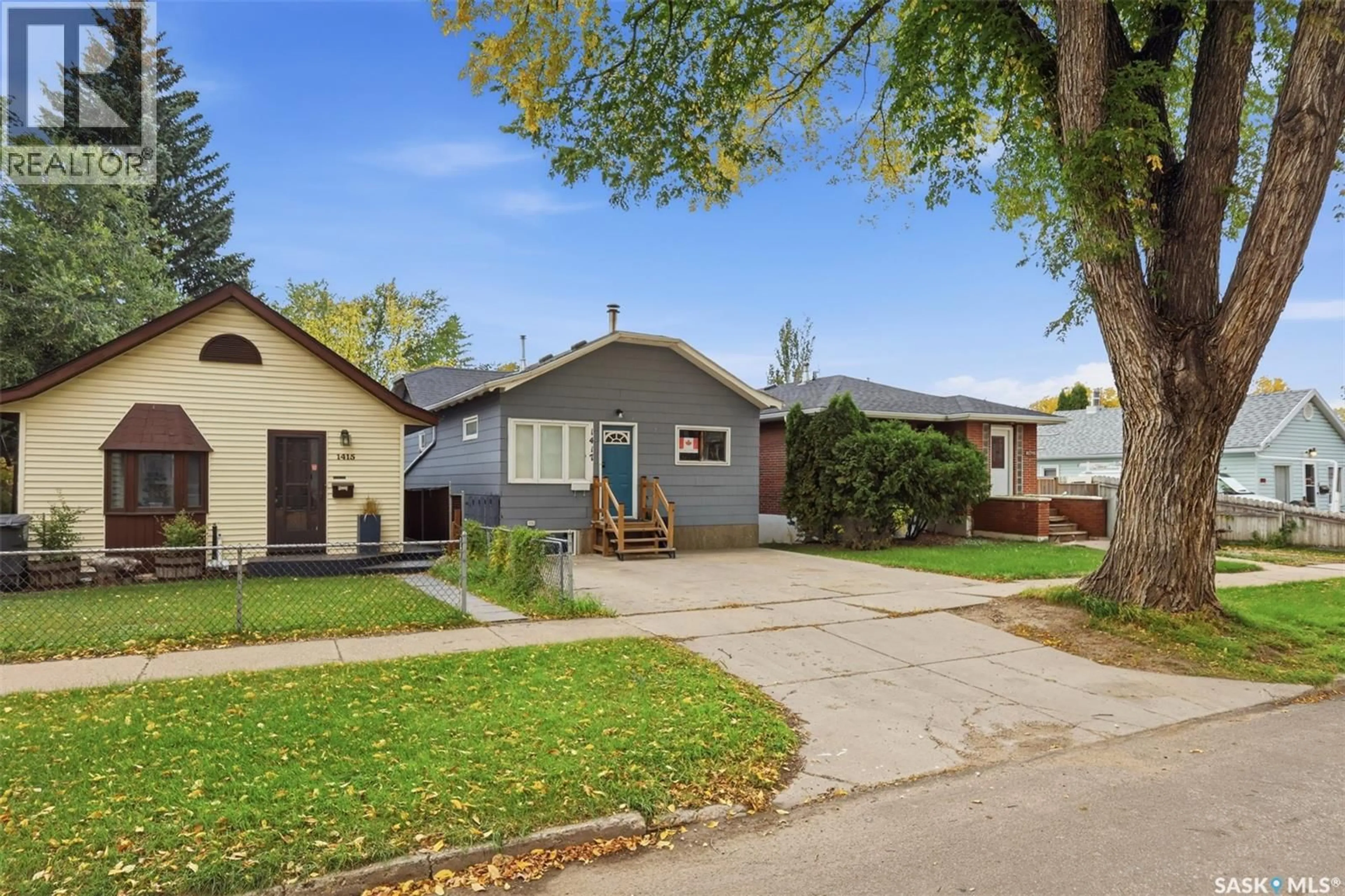 Home with vinyl exterior material, street for 1417 G AVENUE, Saskatoon Saskatchewan S7L2A8