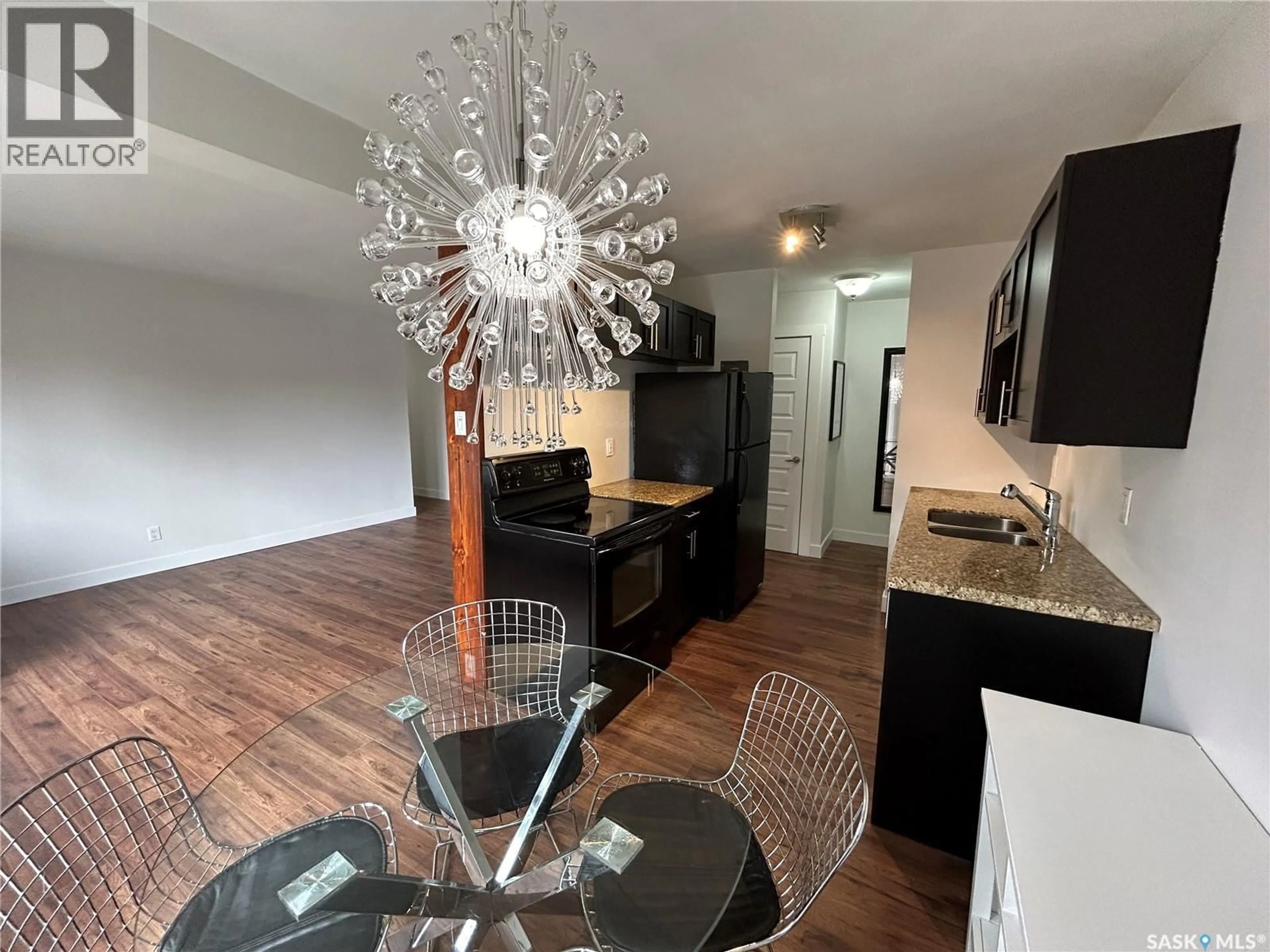 Open concept kitchen, wood/laminate floor for 17 208 LINDSAY PLACE, Saskatoon Saskatchewan S7H3E6