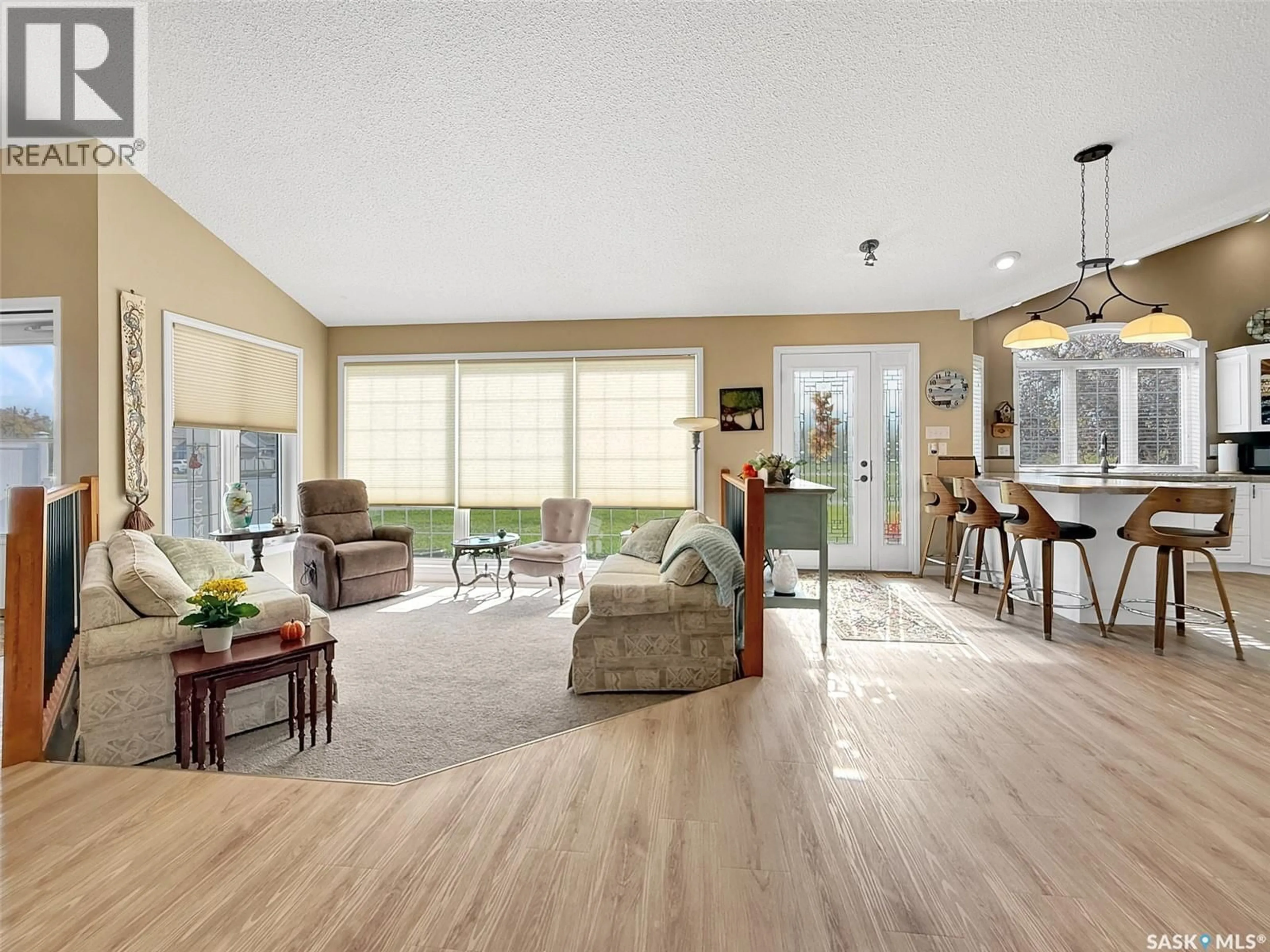 Living room with furniture, wood/laminate floor for B - 558 8TH AVENUE, Swift Current Saskatchewan S9H2R1