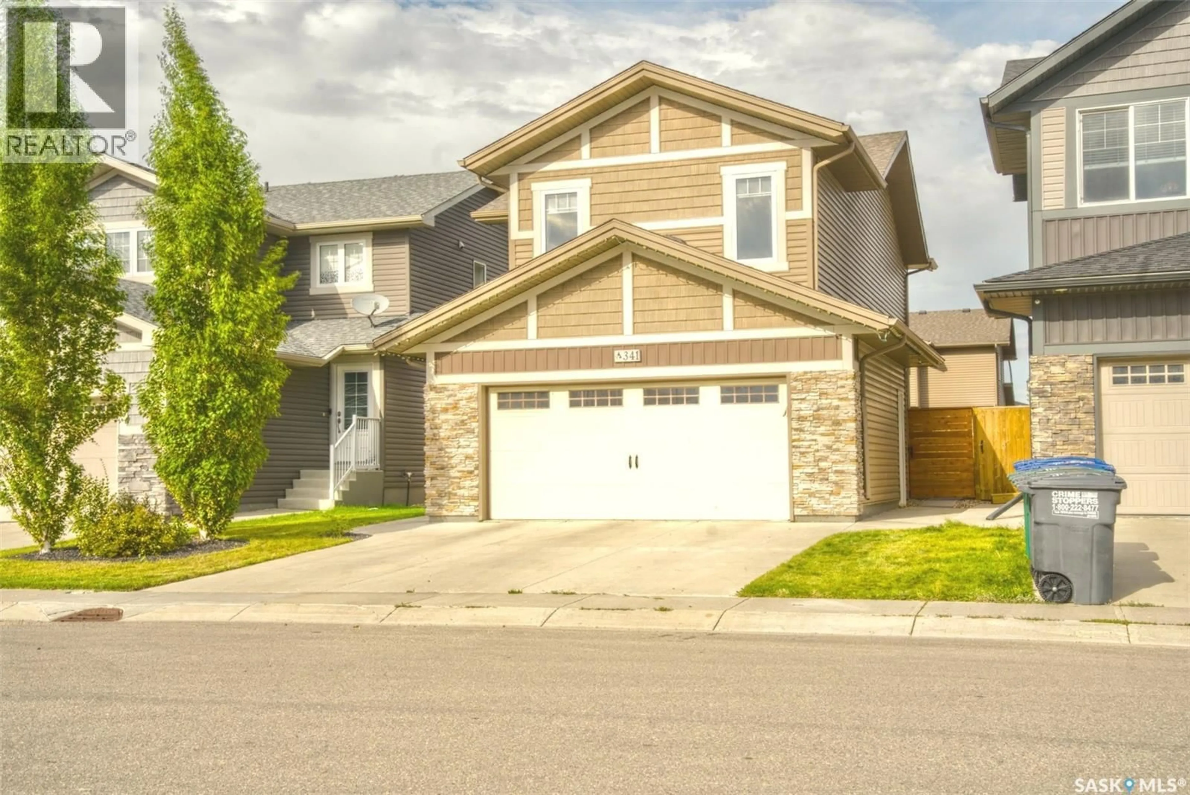 Home with vinyl exterior material, street for 341 GERMAIN MANOR, Saskatoon Saskatchewan S0K2T0