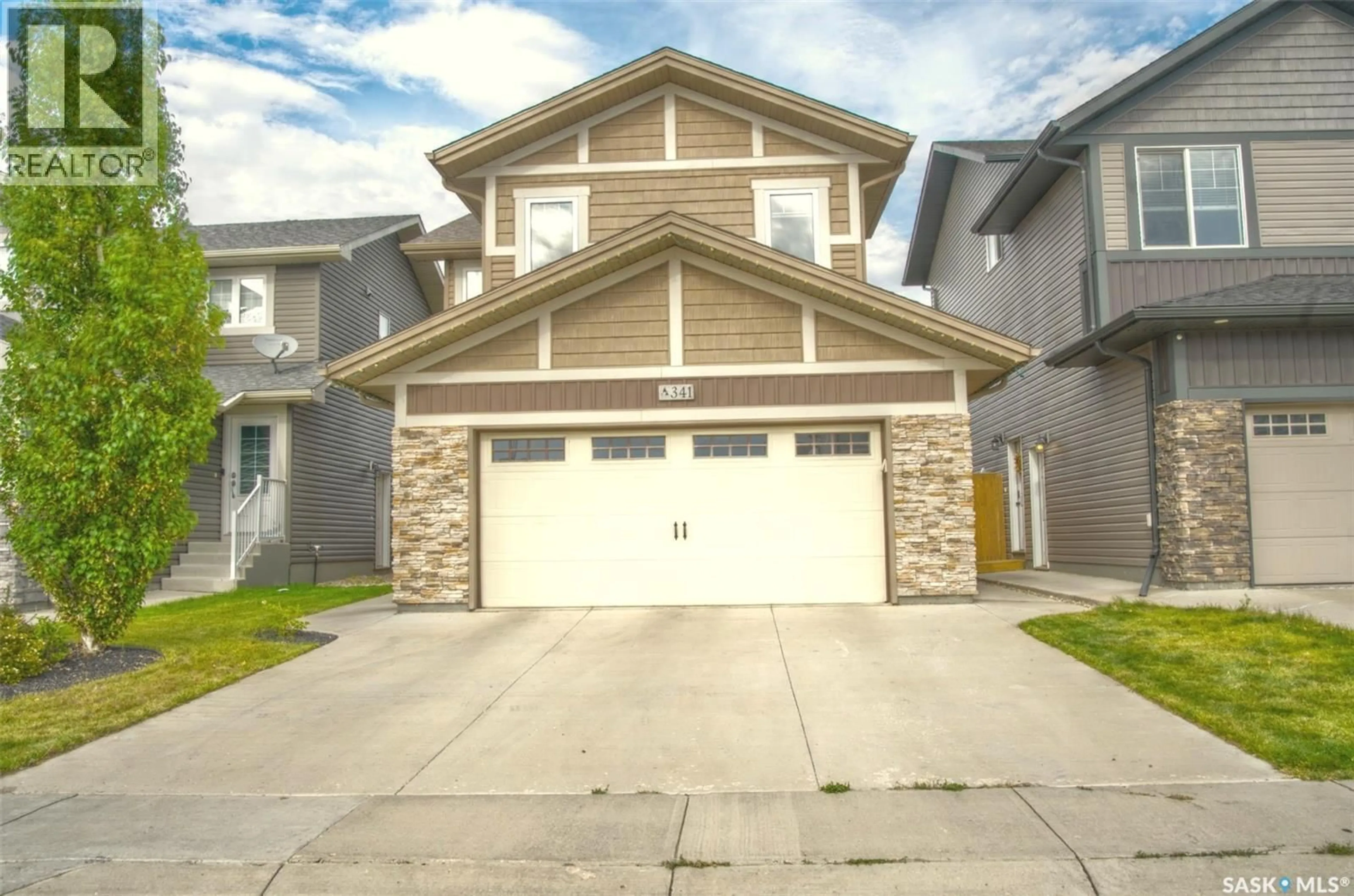 Home with vinyl exterior material, street for 341 GERMAIN MANOR, Saskatoon Saskatchewan S0K2T0