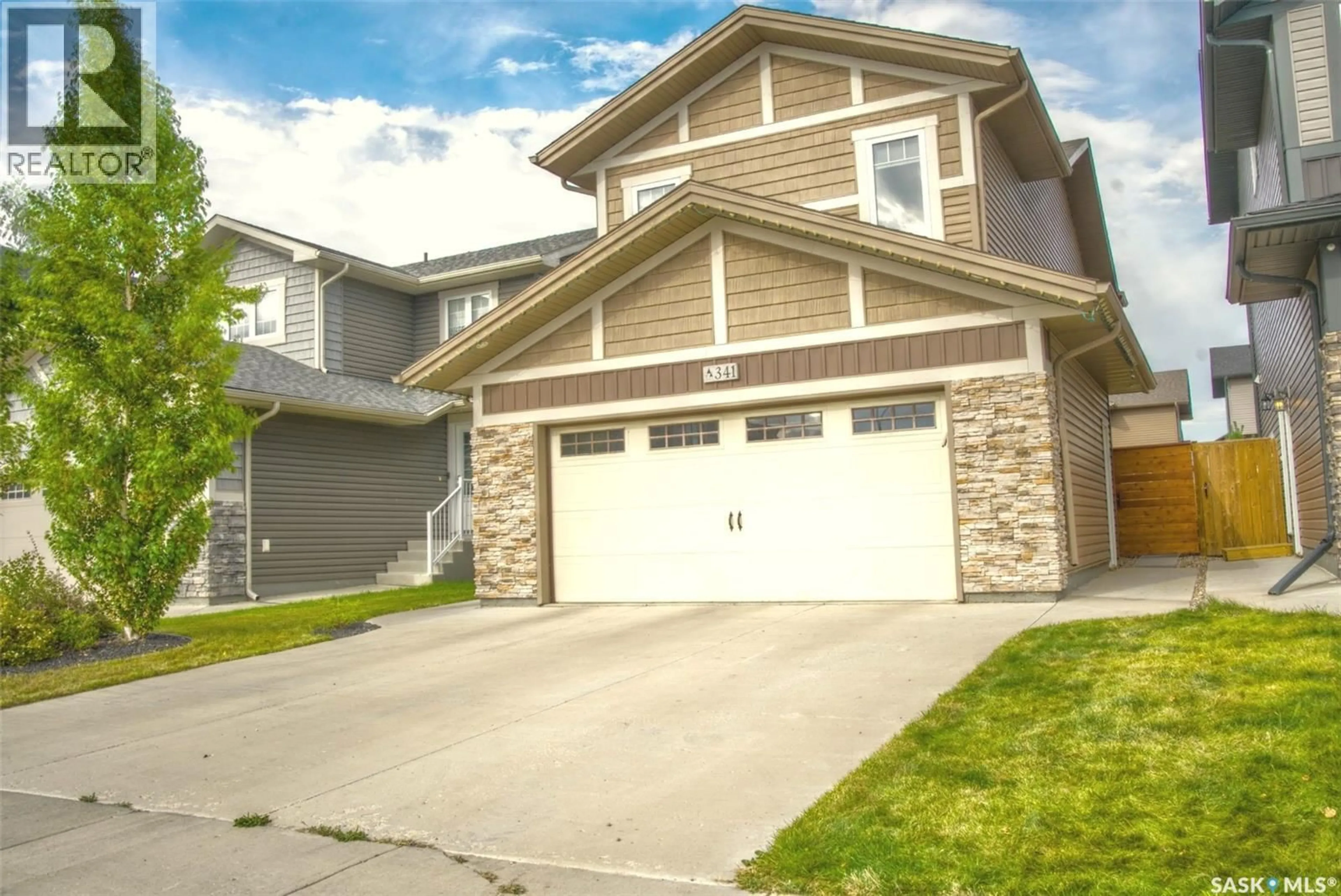 Home with vinyl exterior material, street for 341 GERMAIN MANOR, Saskatoon Saskatchewan S0K2T0
