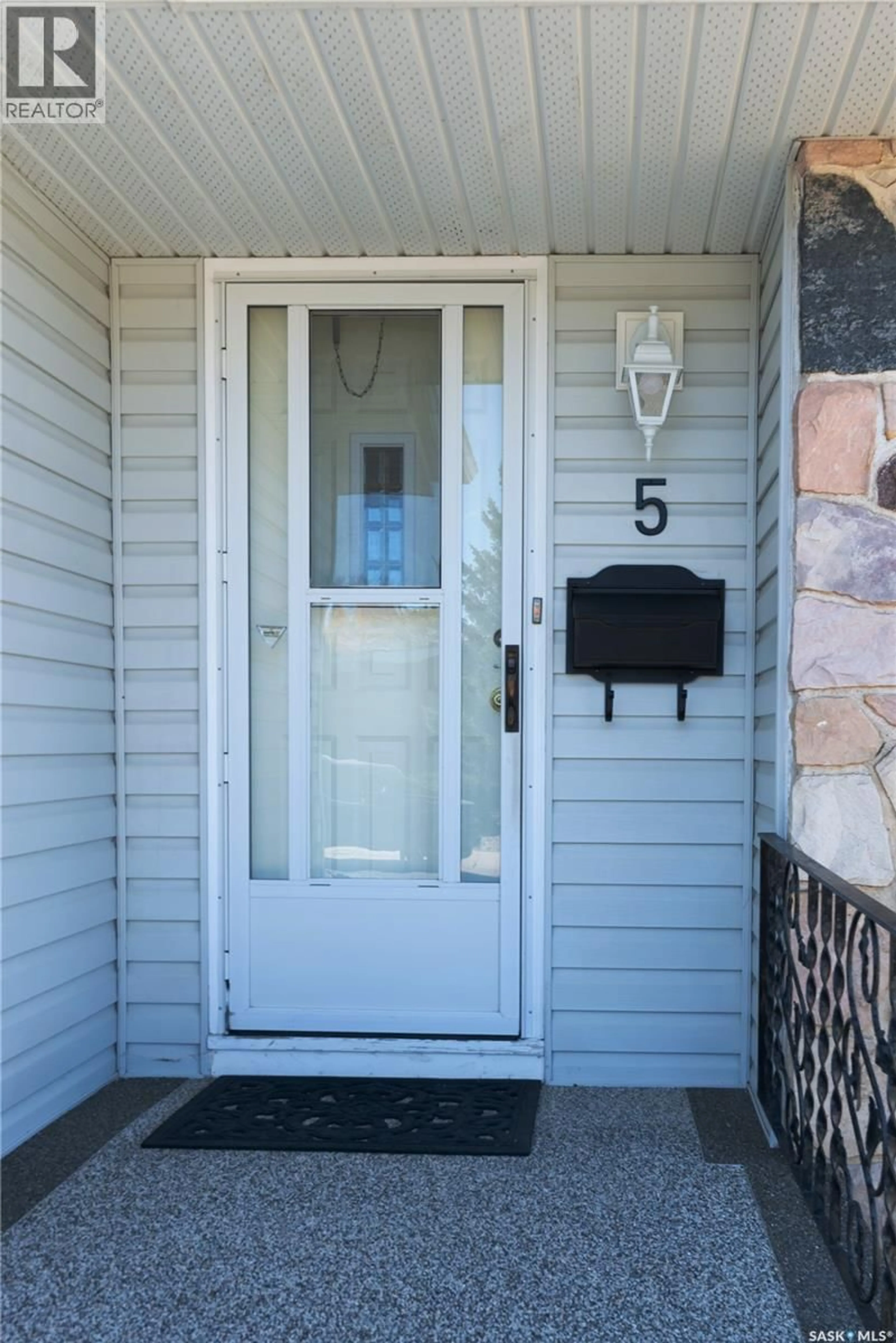 Home with vinyl exterior material, street for 5 WHEATON CRESCENT, Regina Saskatchewan S4S2Z3
