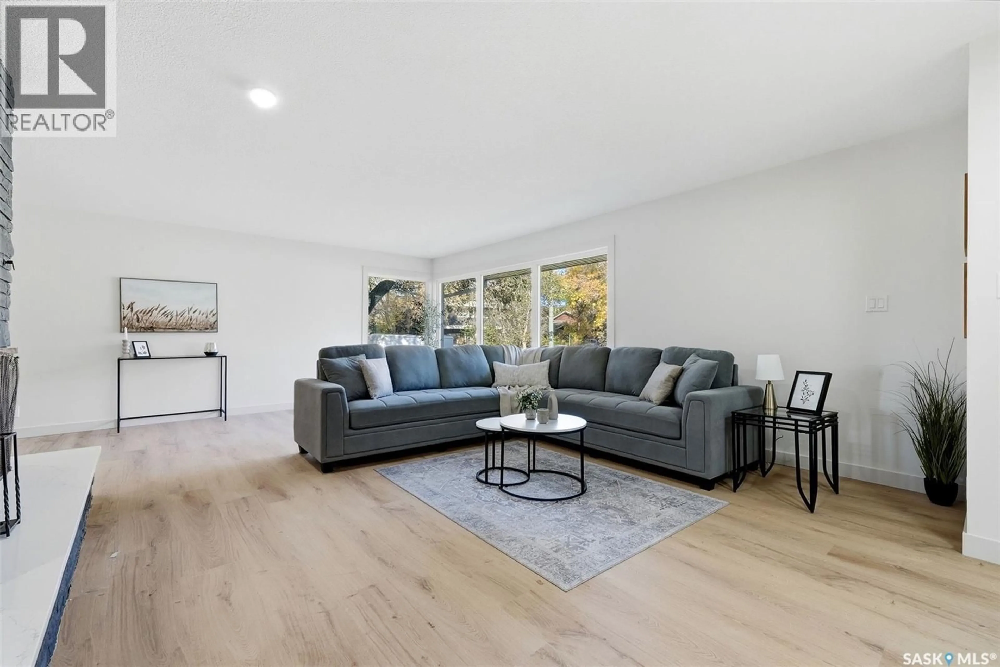 Living room with furniture, wood/laminate floor for 2251 JUBILEE AVENUE, Regina Saskatchewan S4S3V3