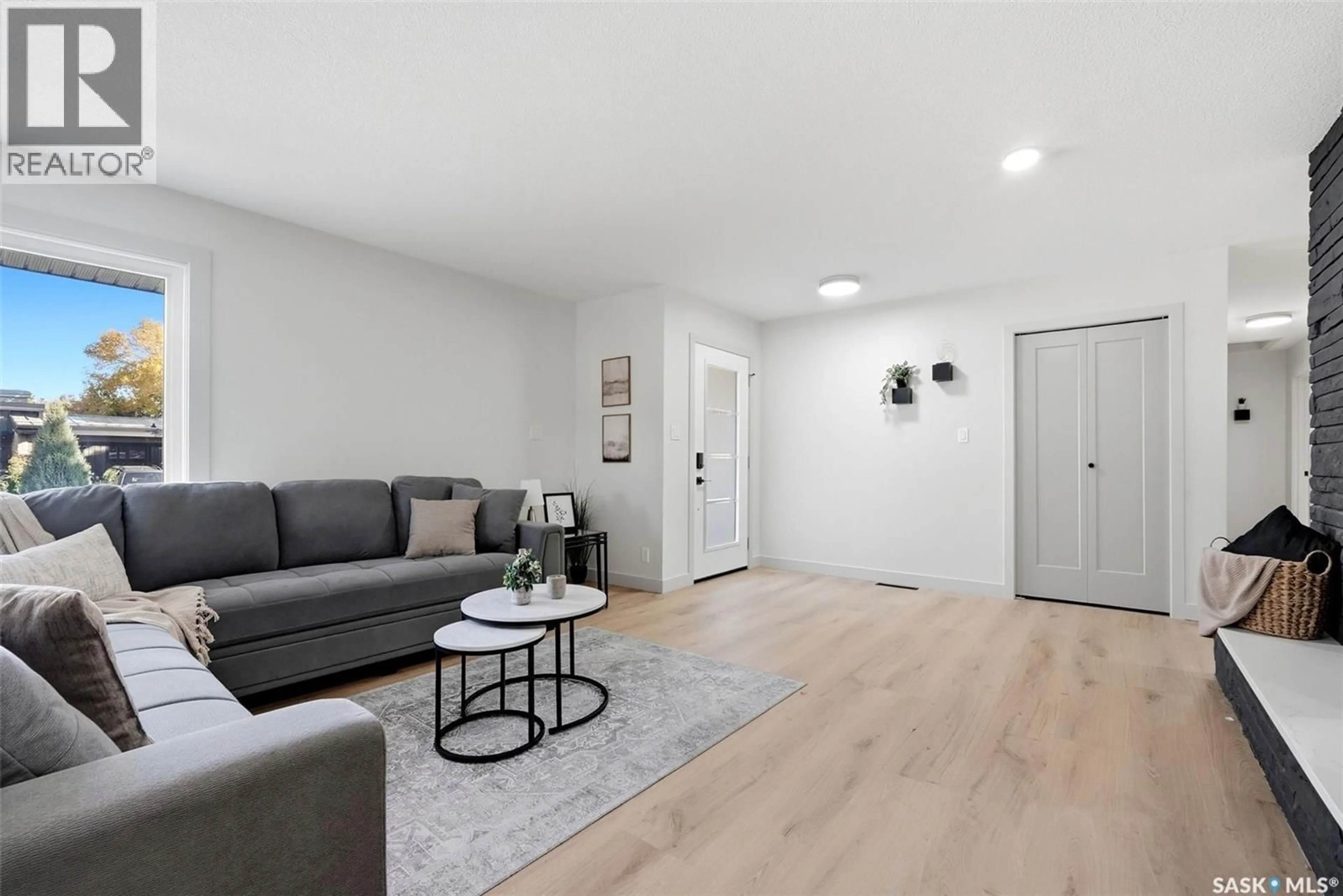Living room with furniture, wood/laminate floor for 2251 JUBILEE AVENUE, Regina Saskatchewan S4S3V3