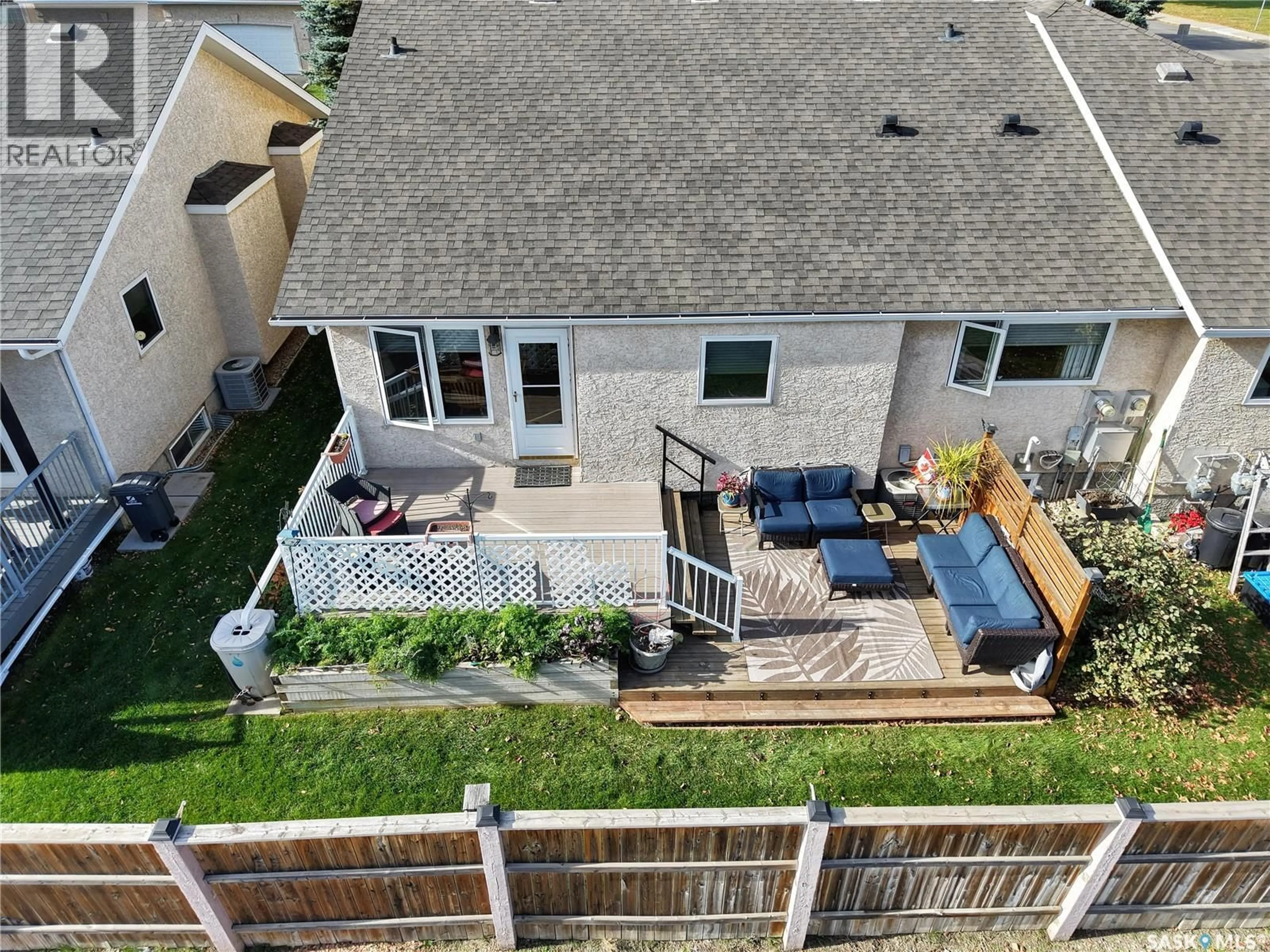 A pic from outside/outdoor area/front of a property/back of a property/a pic from drone, unknown for 135 - 3 PINEHOUSE DRIVE, Saskatoon Saskatchewan S7K5W1