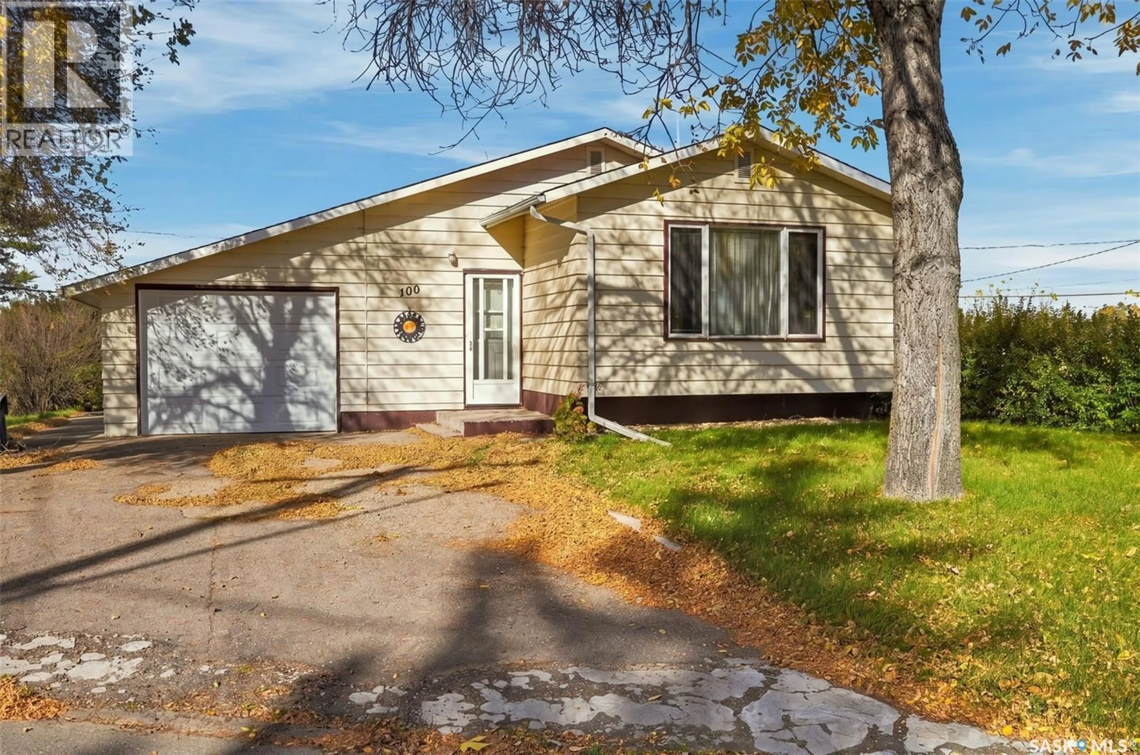 Home with vinyl exterior material, street for 100 1ST AVENUE, Ituna Saskatchewan S0A1N0