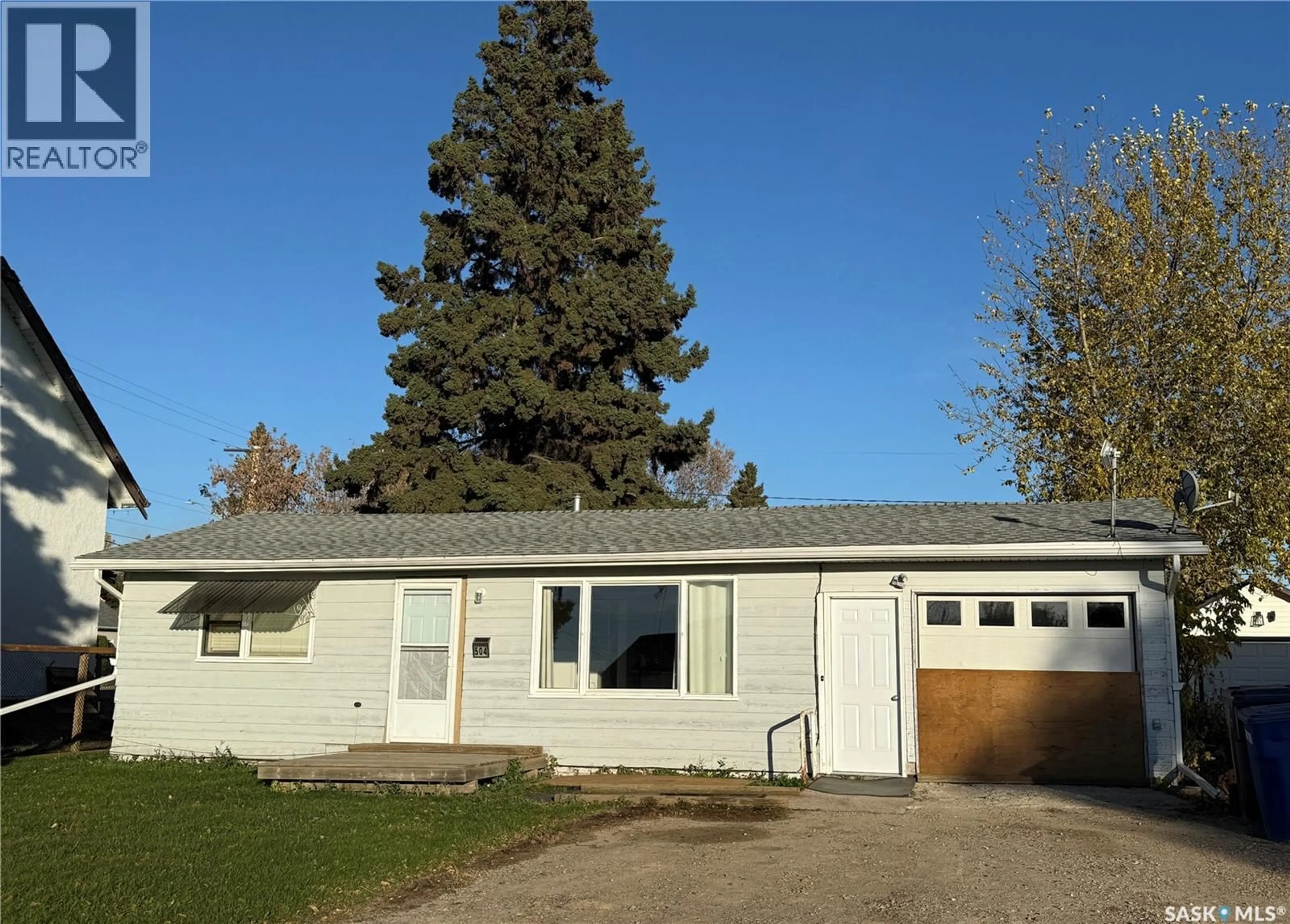 Home with vinyl exterior material, street for 504 3RD STREET, Meadow Lake Saskatchewan S9X1C9