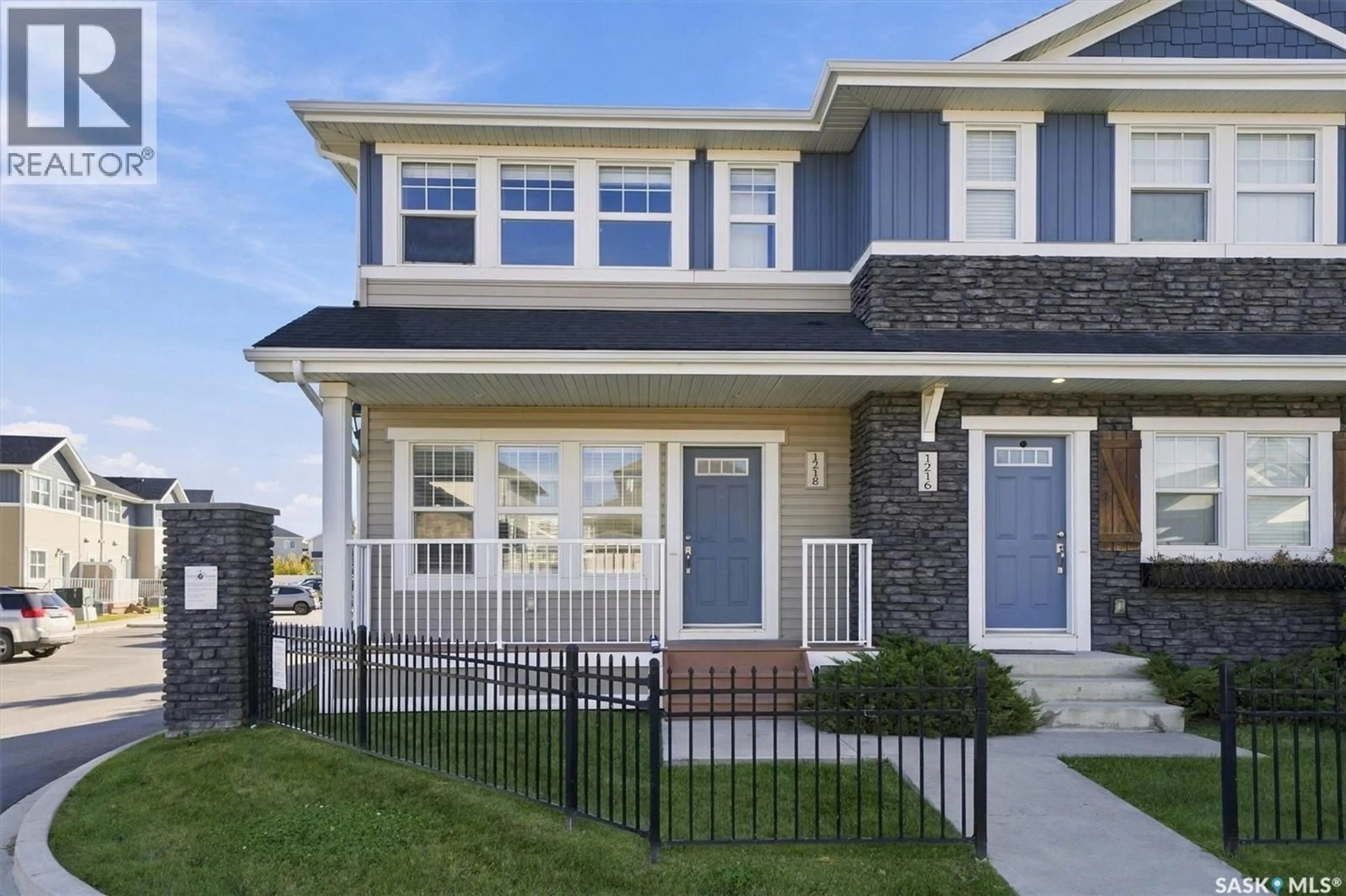 Home with vinyl exterior material, street for 1218 PRINGLE WAY, Saskatoon Saskatchewan S7T0X5