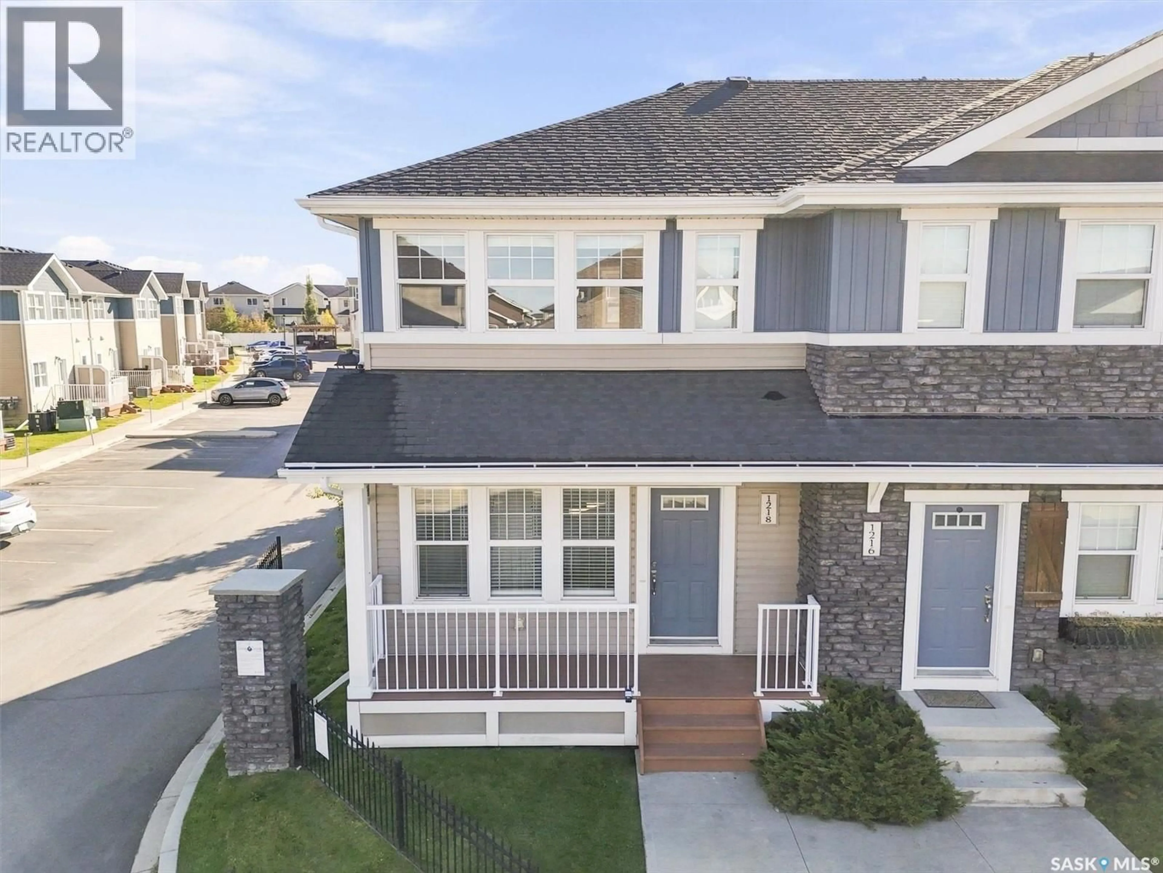 Home with vinyl exterior material, street for 1218 PRINGLE WAY, Saskatoon Saskatchewan S7T0X5
