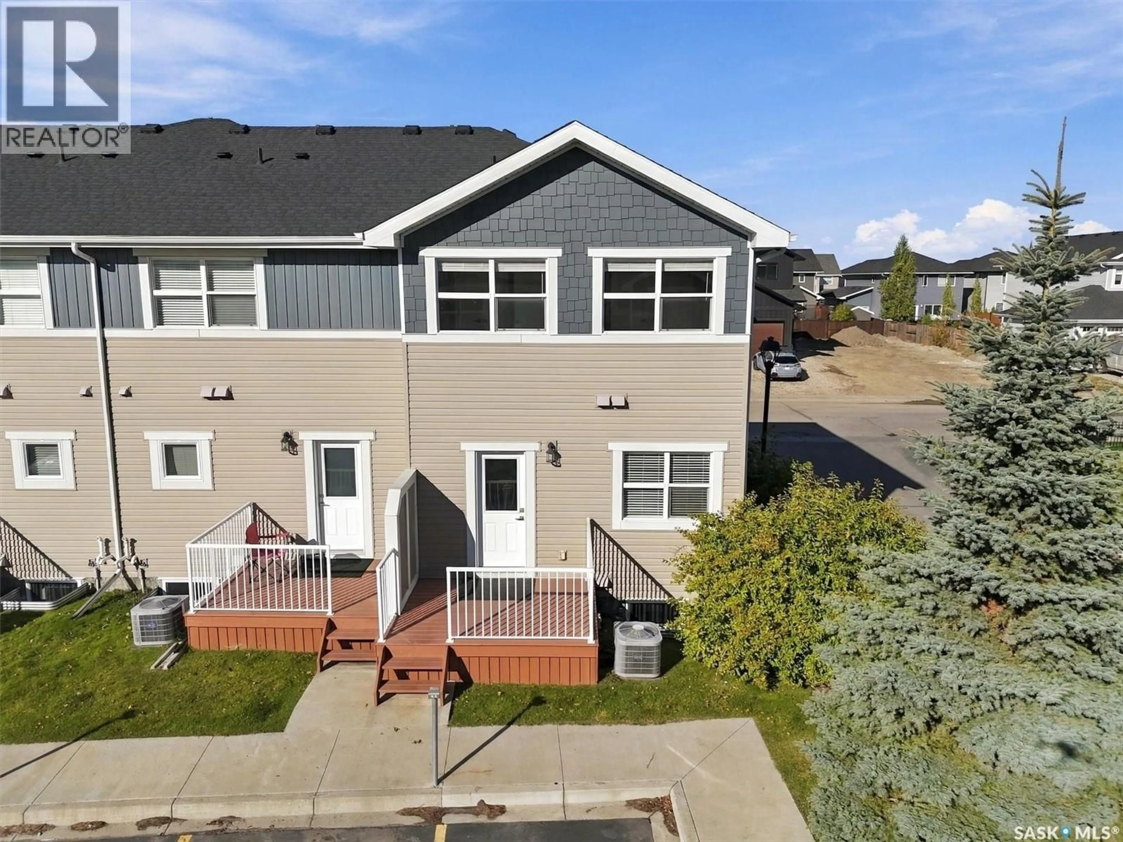 A pic from outside/outdoor area/front of a property/back of a property/a pic from drone, street for 1218 PRINGLE WAY, Saskatoon Saskatchewan S7T0X5