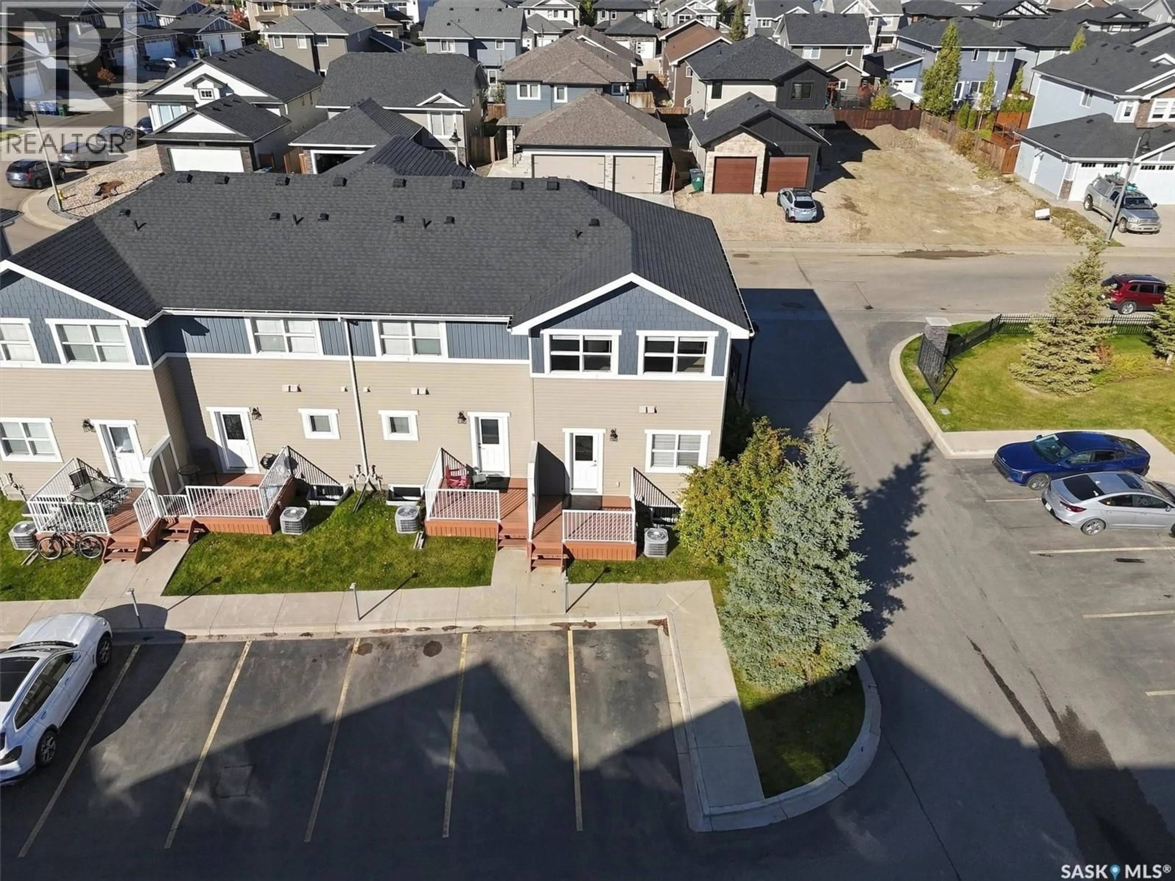 A pic from outside/outdoor area/front of a property/back of a property/a pic from drone, street for 1218 PRINGLE WAY, Saskatoon Saskatchewan S7T0X5