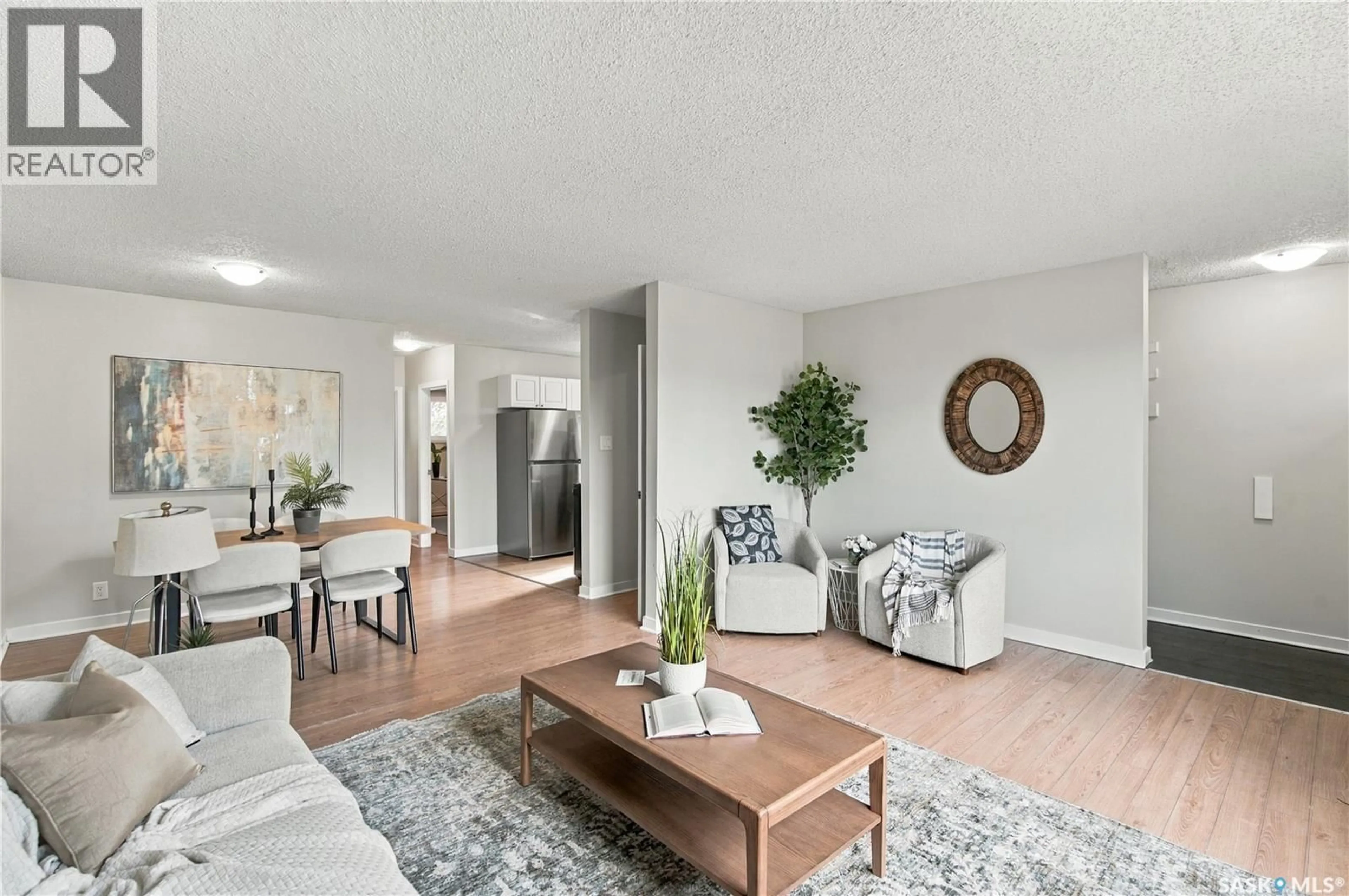Living room with furniture, wood/laminate floor for 431 YORK STREET, Regina Saskatchewan S4R4W7