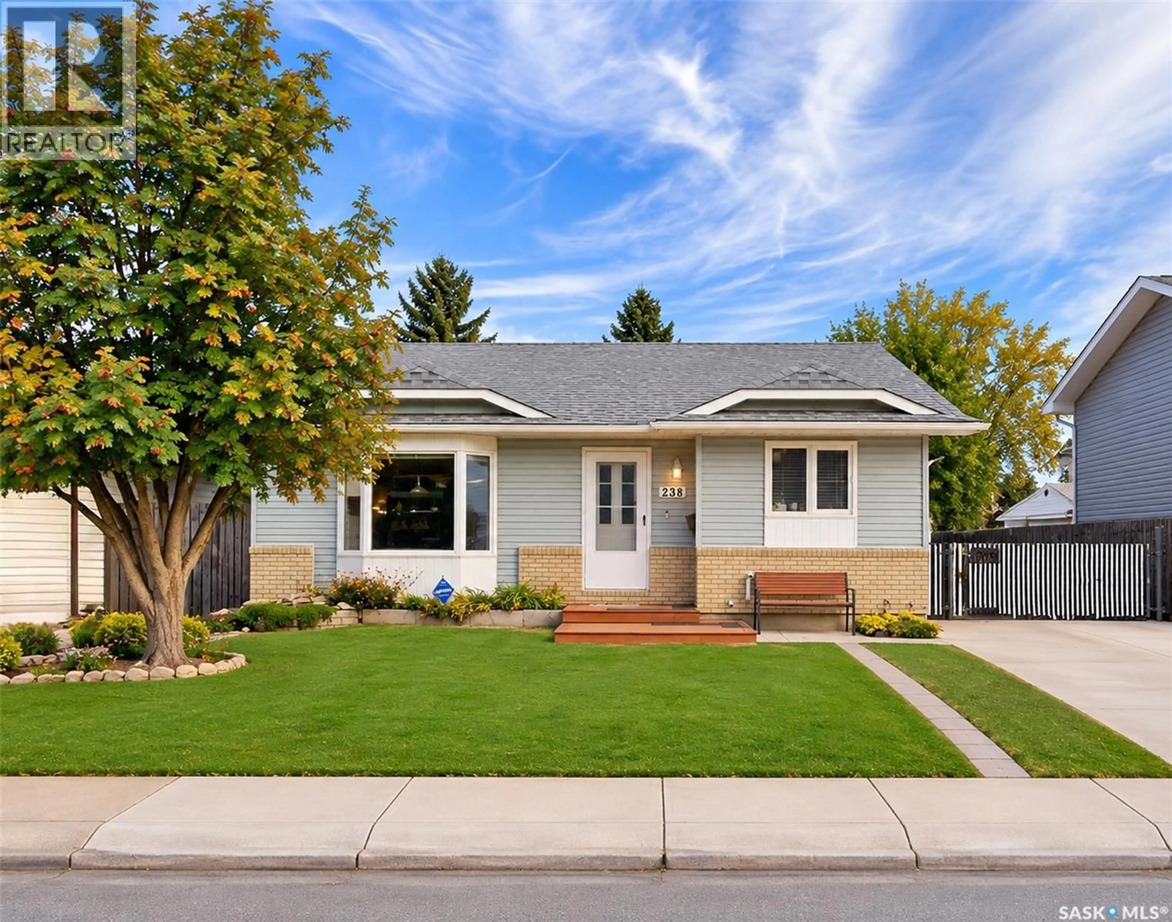 Home with vinyl exterior material, street for 238 SHERRY CRESCENT, Saskatoon Saskatchewan S7M5R5