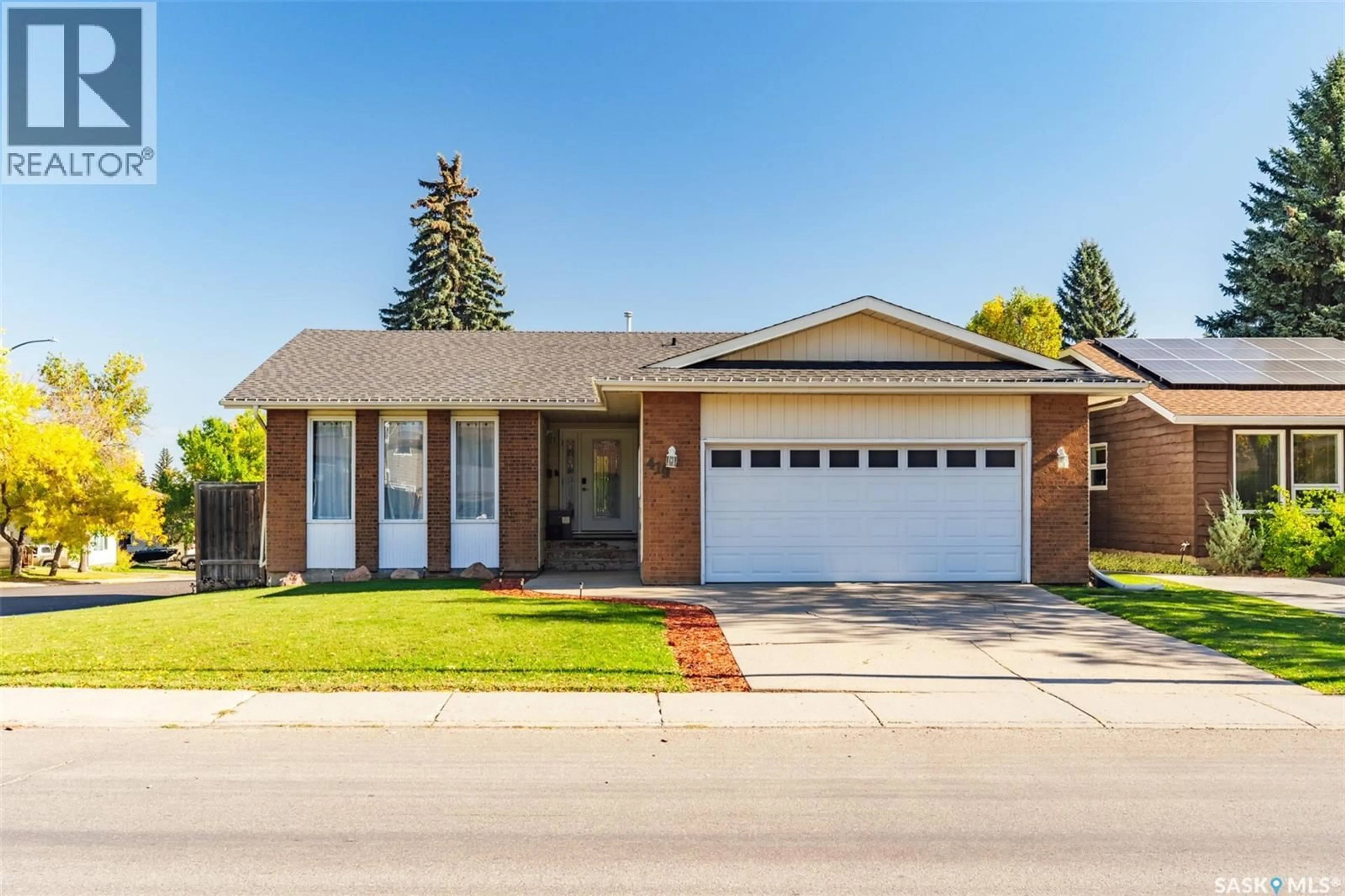 Home with brick exterior material, street for 419 KINGSMERE BOULEVARD, Saskatoon Saskatchewan S7J3T9