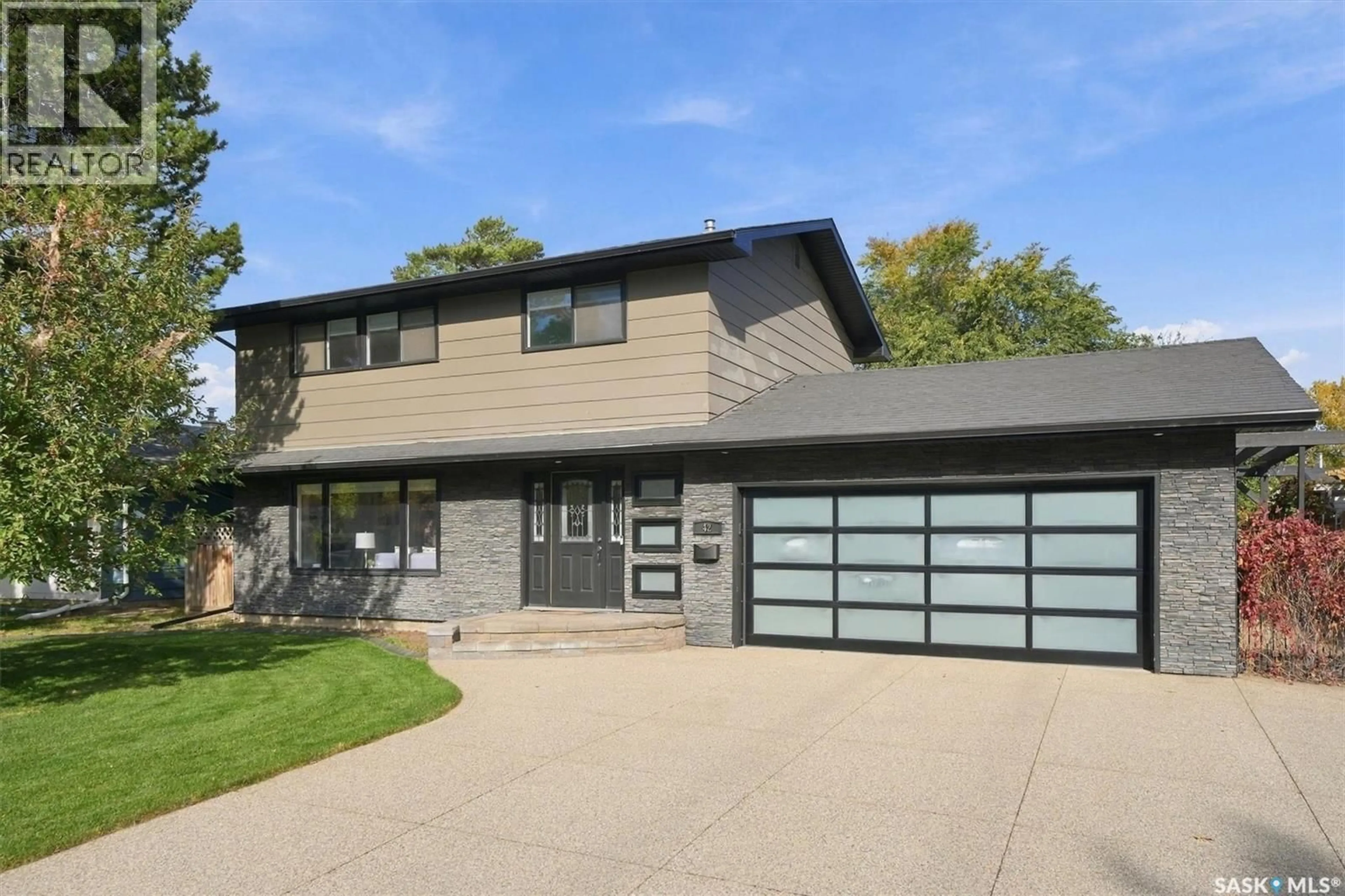 Home with vinyl exterior material, street for 42 KOOTENAY DRIVE, Saskatoon Saskatchewan S7K1J1