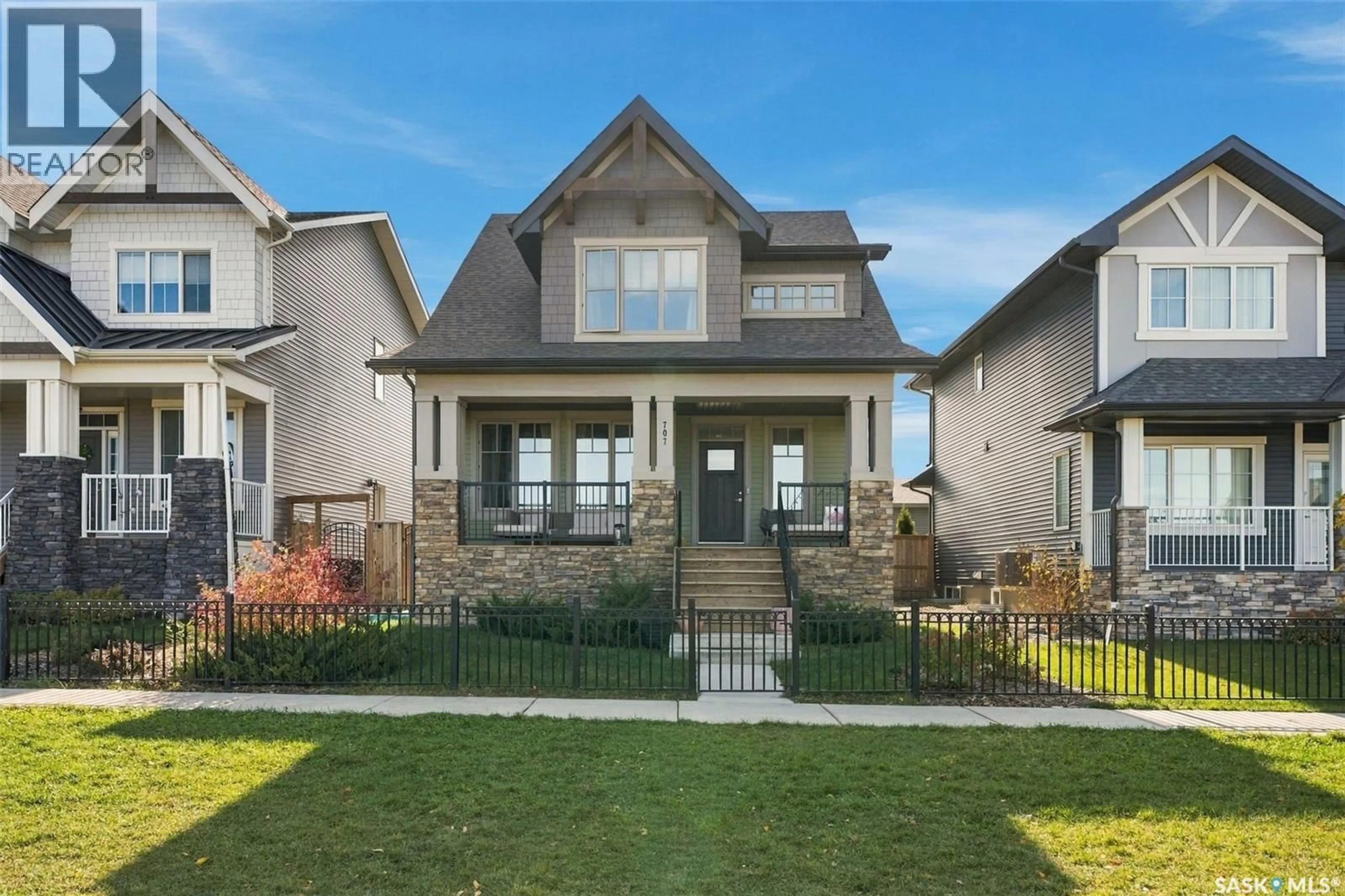 Home with brick exterior material, street for 707 UNDERHILL LANE, Saskatoon Saskatchewan S7V0N3