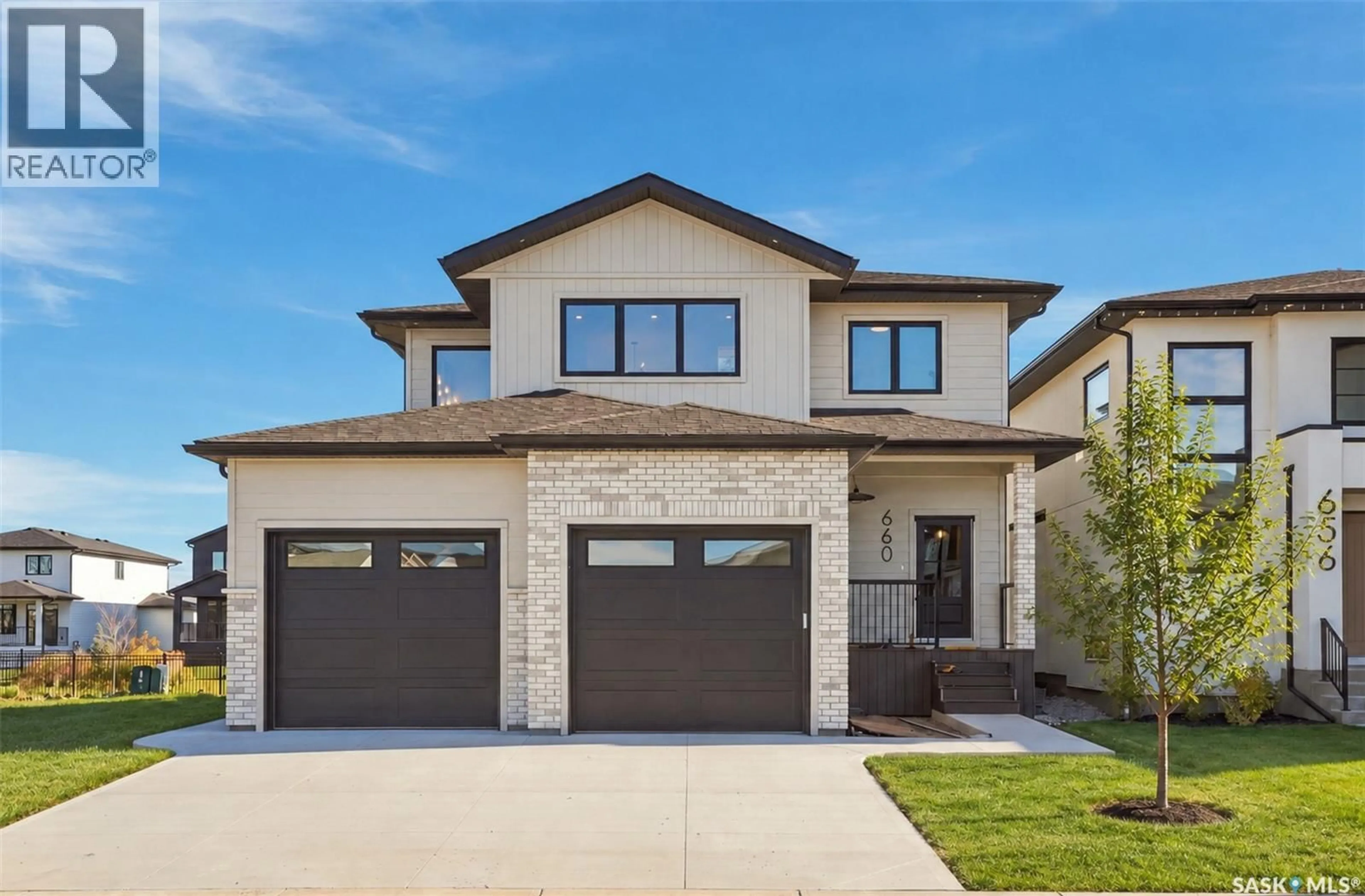 Home with brick exterior material, street for 660 PEPPER BEND, Saskatoon Saskatchewan S7N1Y6