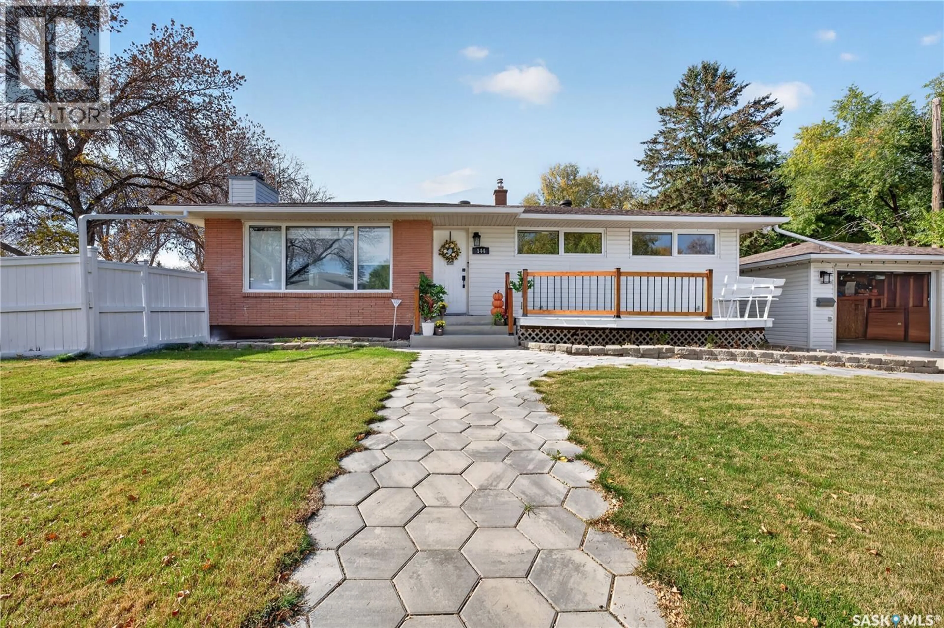 Home with vinyl exterior material, street for 144 ORCHARD CRESCENT, Regina Saskatchewan S4S5B6