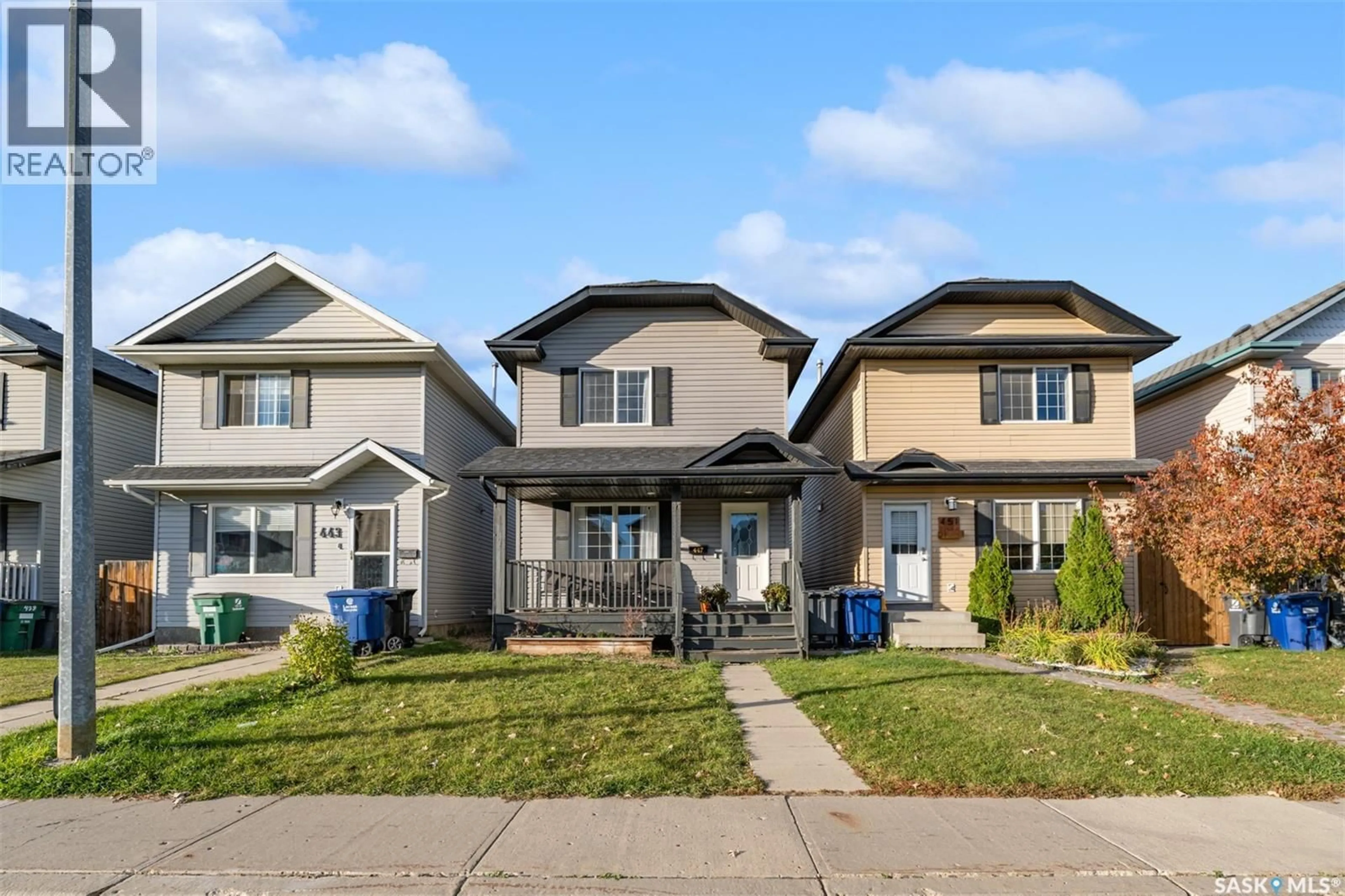 Home with vinyl exterior material, street for 447 BLAKENEY CRESCENT, Saskatoon Saskatchewan S7L7N5