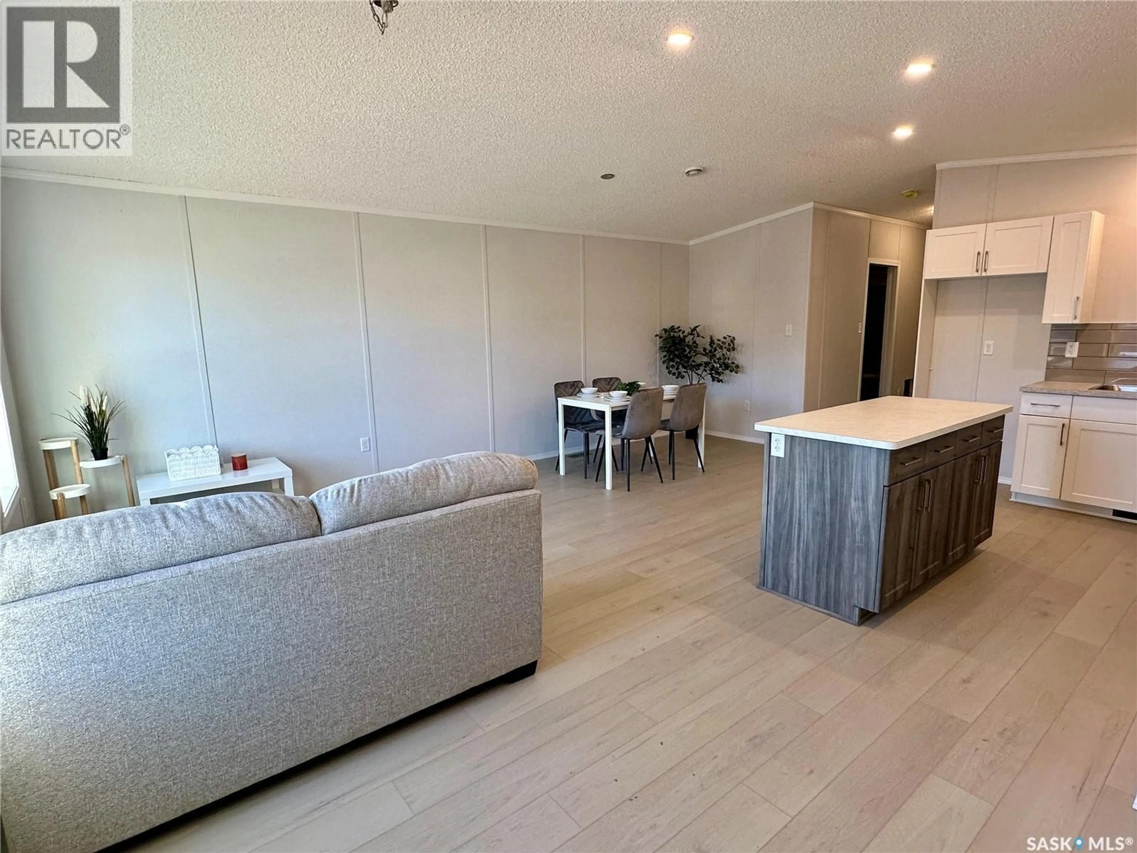Open concept kitchen, wood/laminate floor for 912 QUANDT CRESCENT, La Ronge Saskatchewan S0J1L0