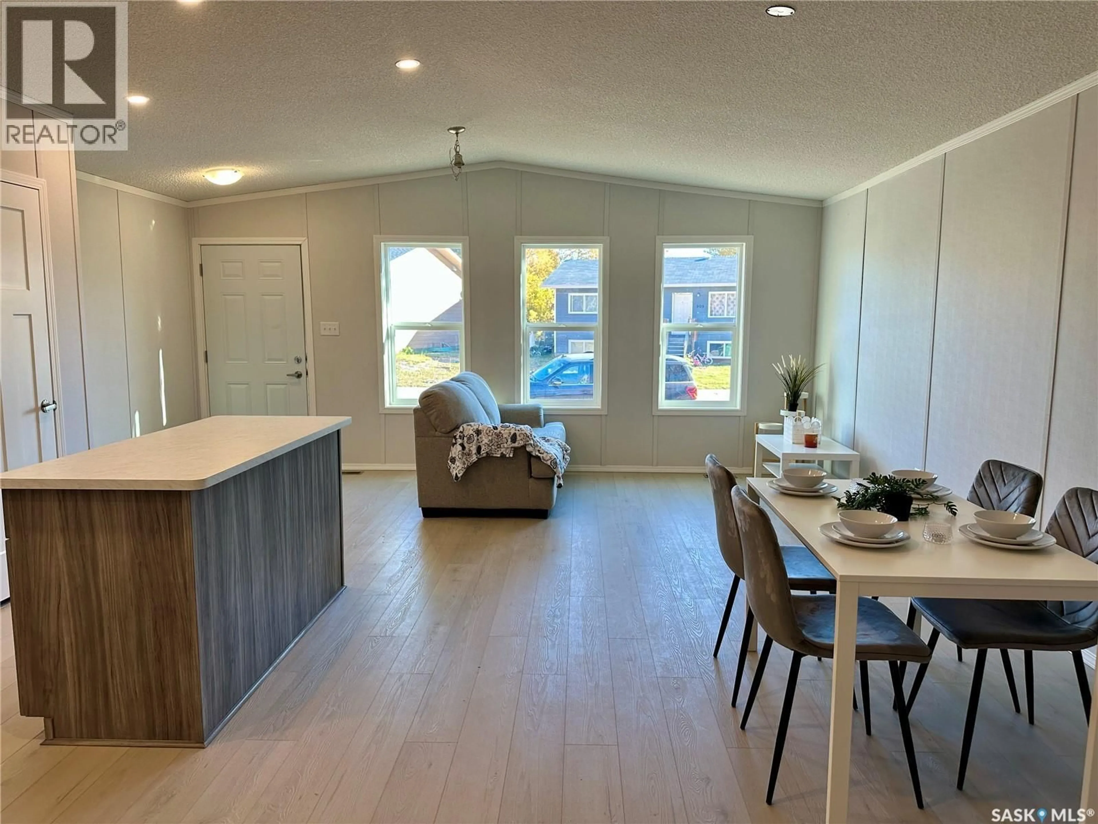 Open concept kitchen, wood/laminate floor for 912 QUANDT CRESCENT, La Ronge Saskatchewan S0J1L0