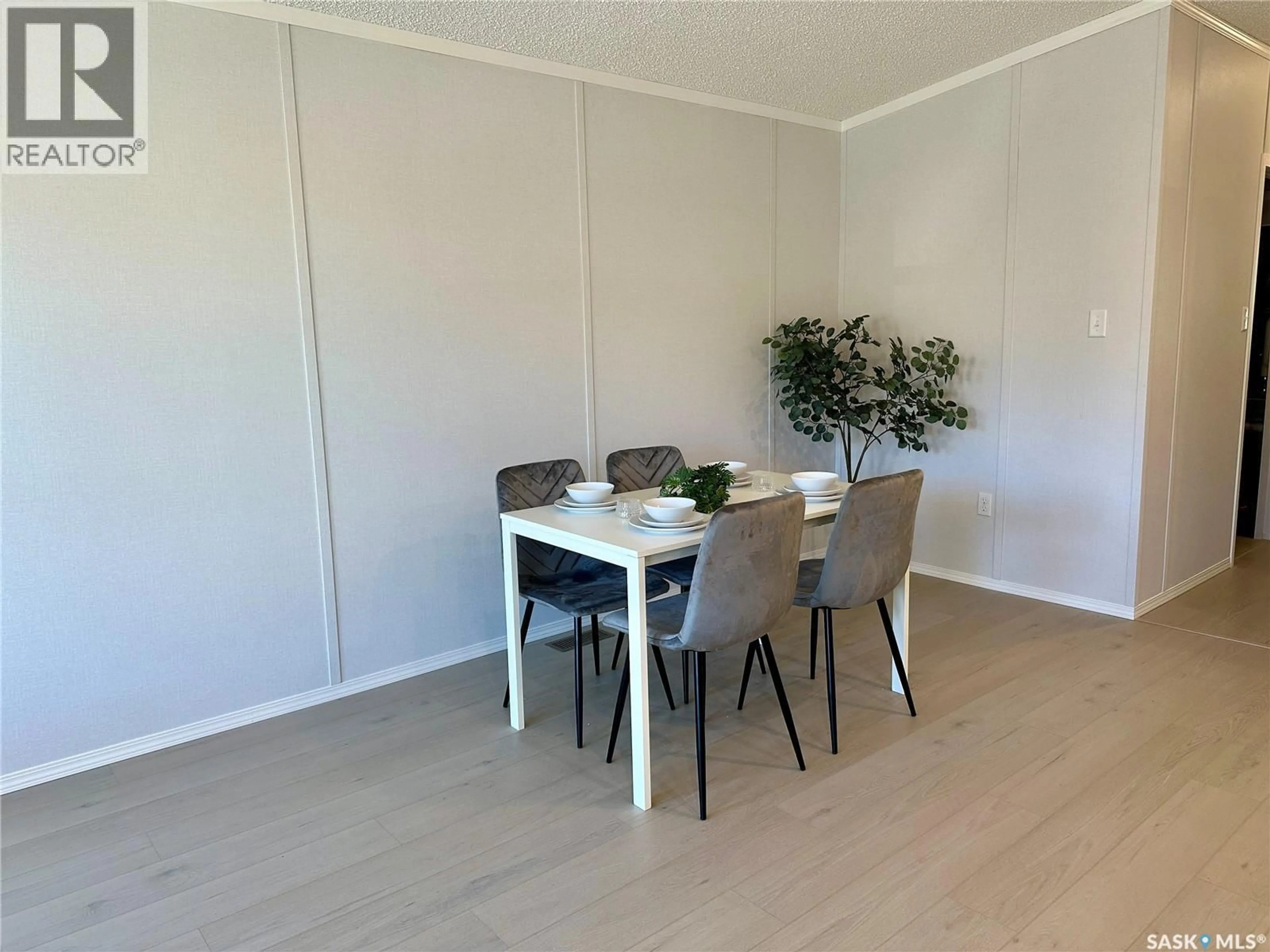 Dining room, wood/laminate floor for 912 QUANDT CRESCENT, La Ronge Saskatchewan S0J1L0