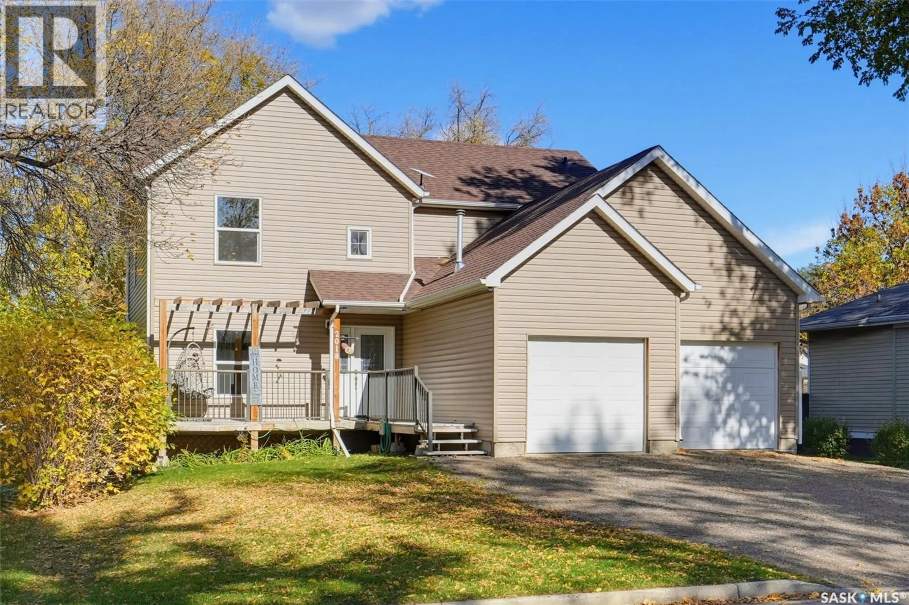 Home with vinyl exterior material, street for 2018 8TH STREET, Rosthern Saskatchewan S0K3R0