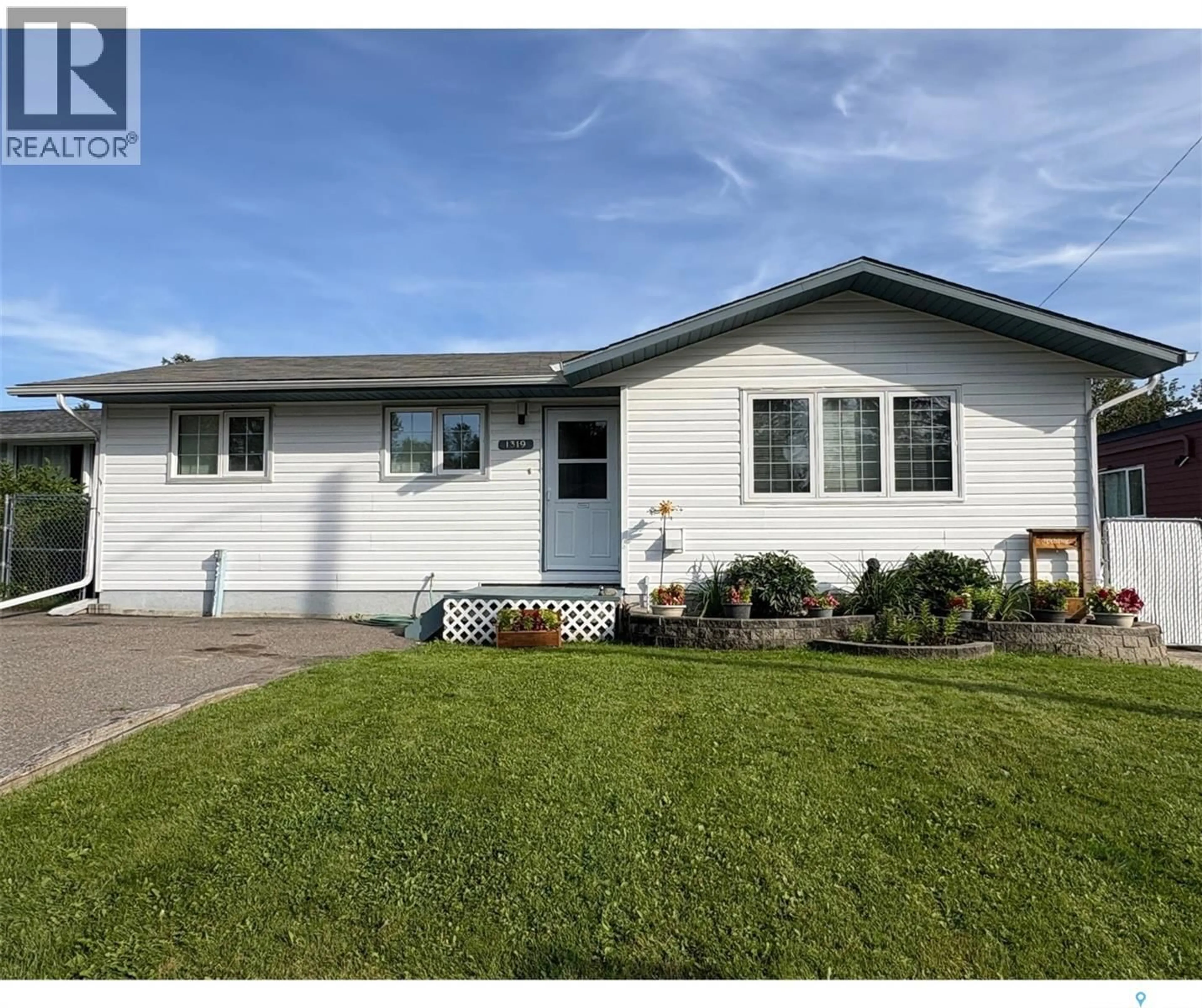 Home with vinyl exterior material, street for 1319 KOWALSKI PLACE, La Ronge Saskatchewan S0J1L0