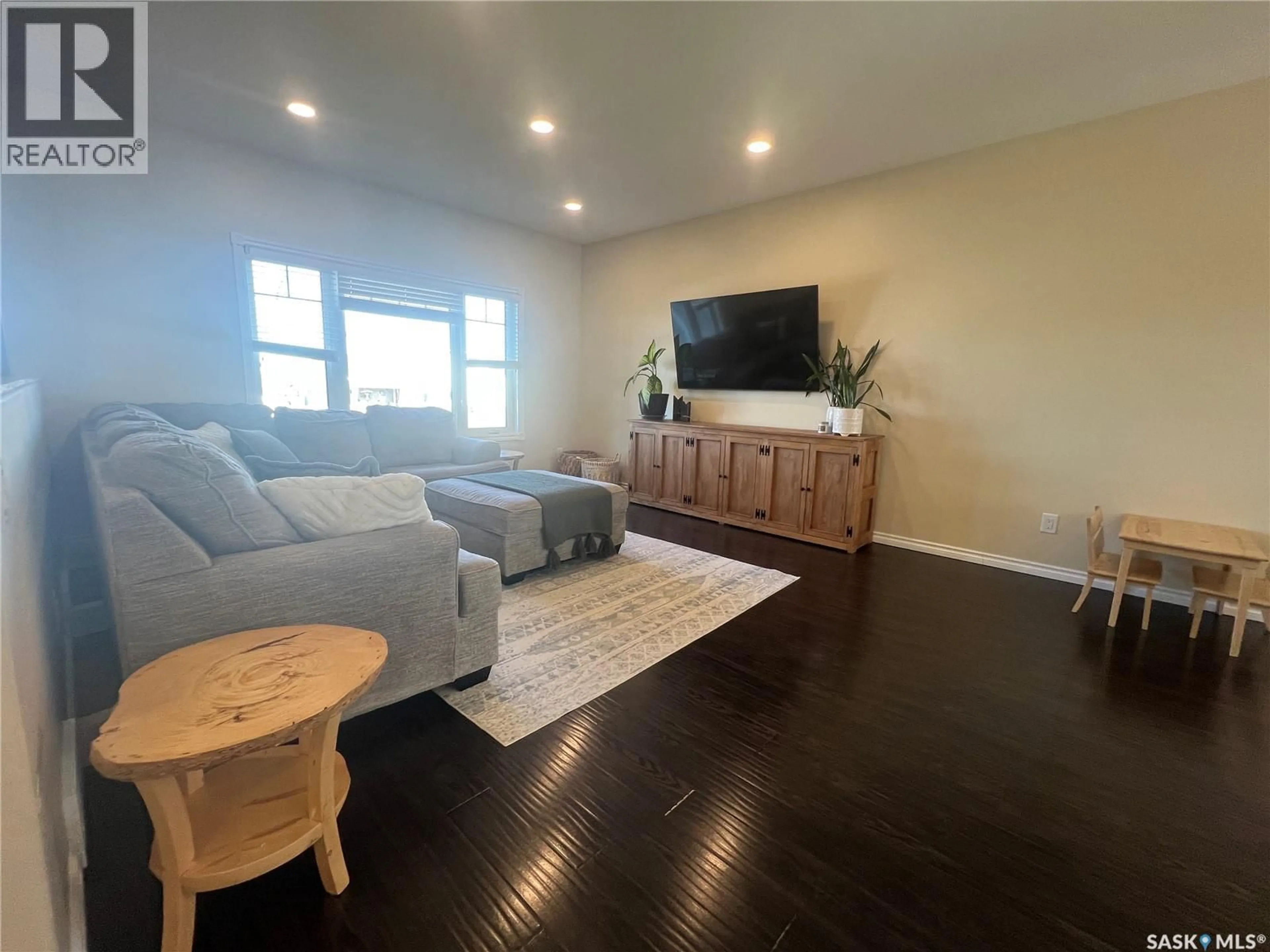 Living room with furniture, wood/laminate floor for 197 5TH AVENUE, Esterhazy Saskatchewan S0A0X0