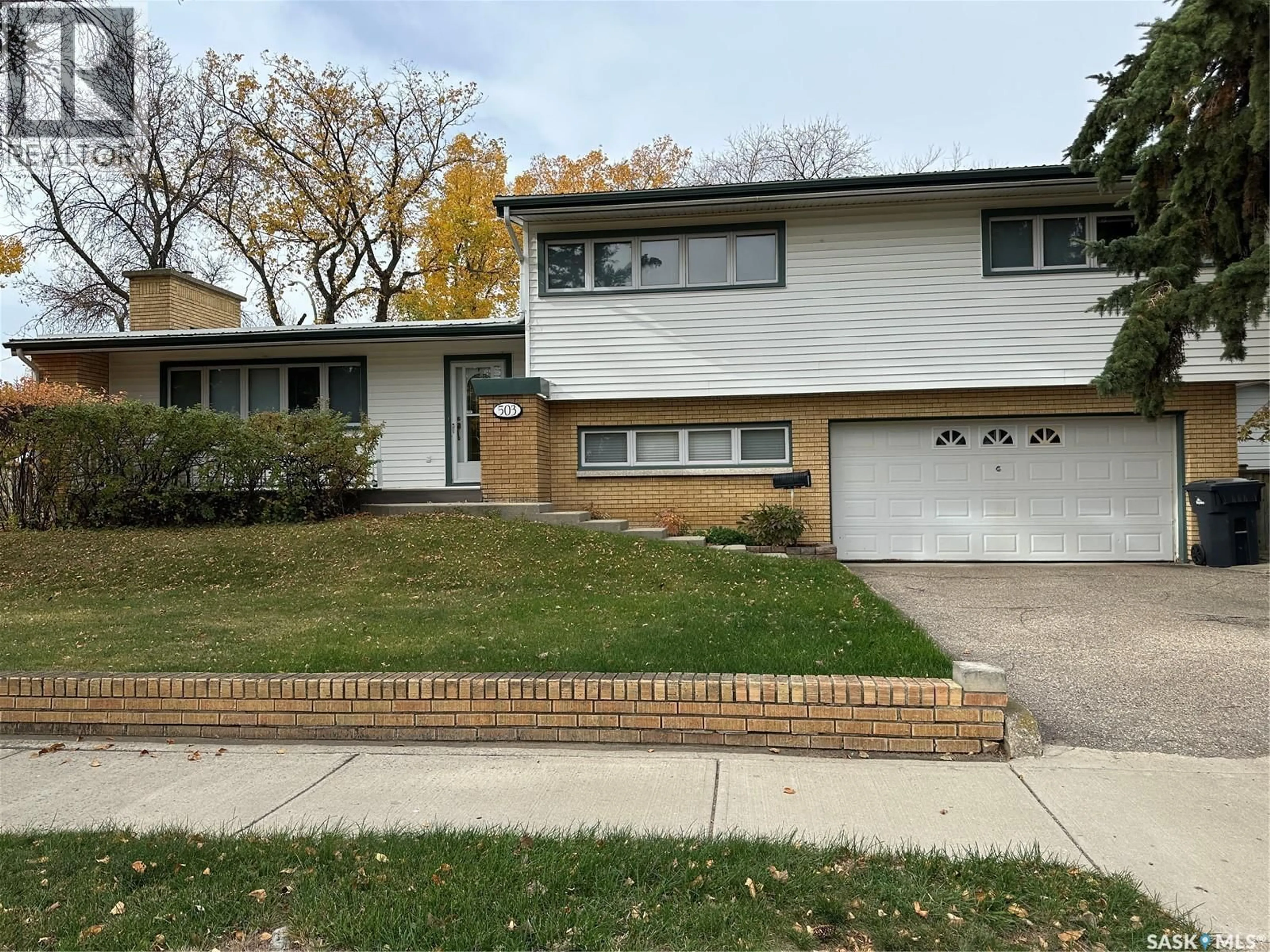 Home with vinyl exterior material, street for 503 9TH STREET, Weyburn Saskatchewan S4H1G2