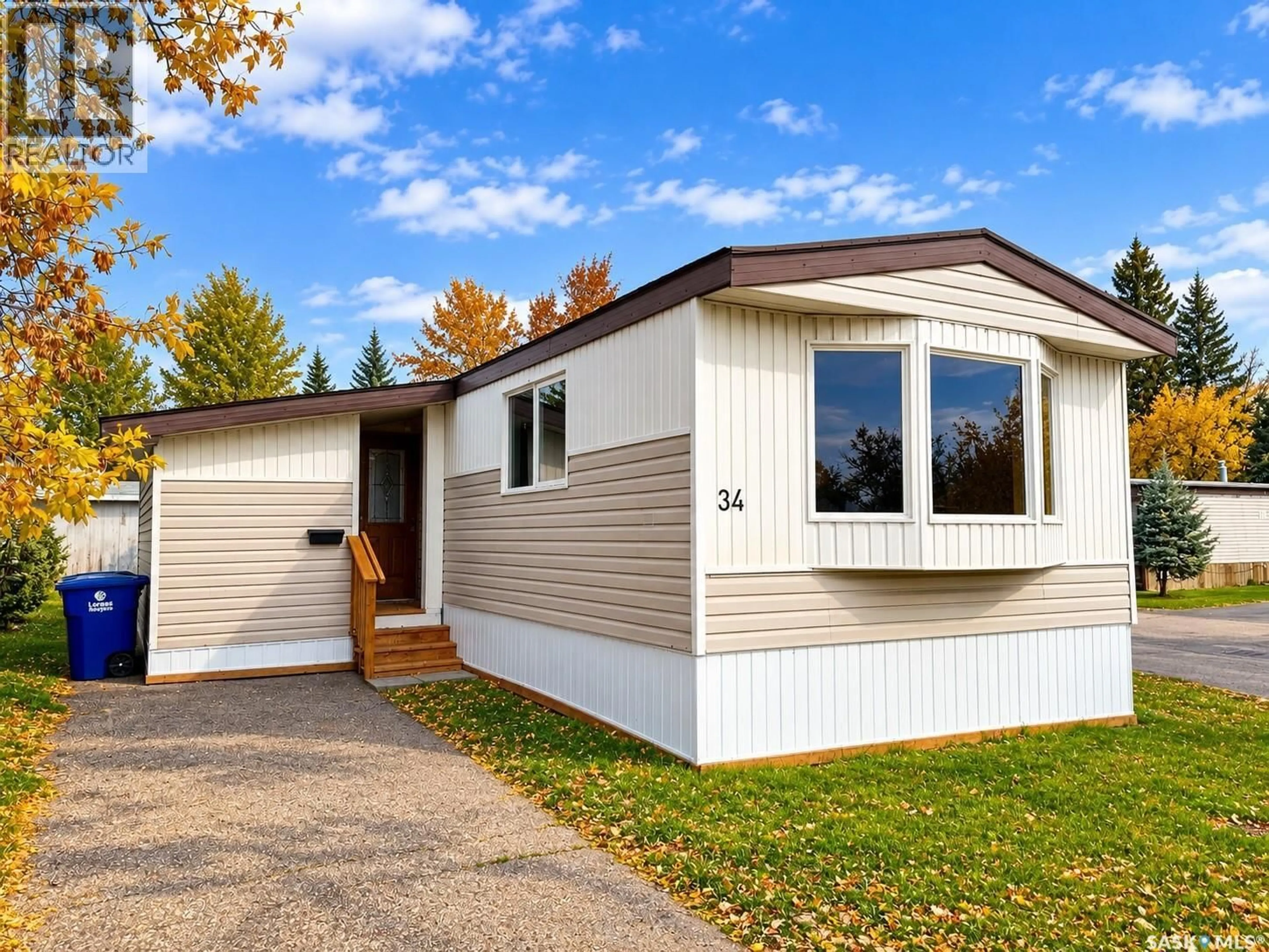 Home with vinyl exterior material, street for 1035 - 34 BOYCHUK DRIVE, Saskatoon Saskatchewan S7H5B2