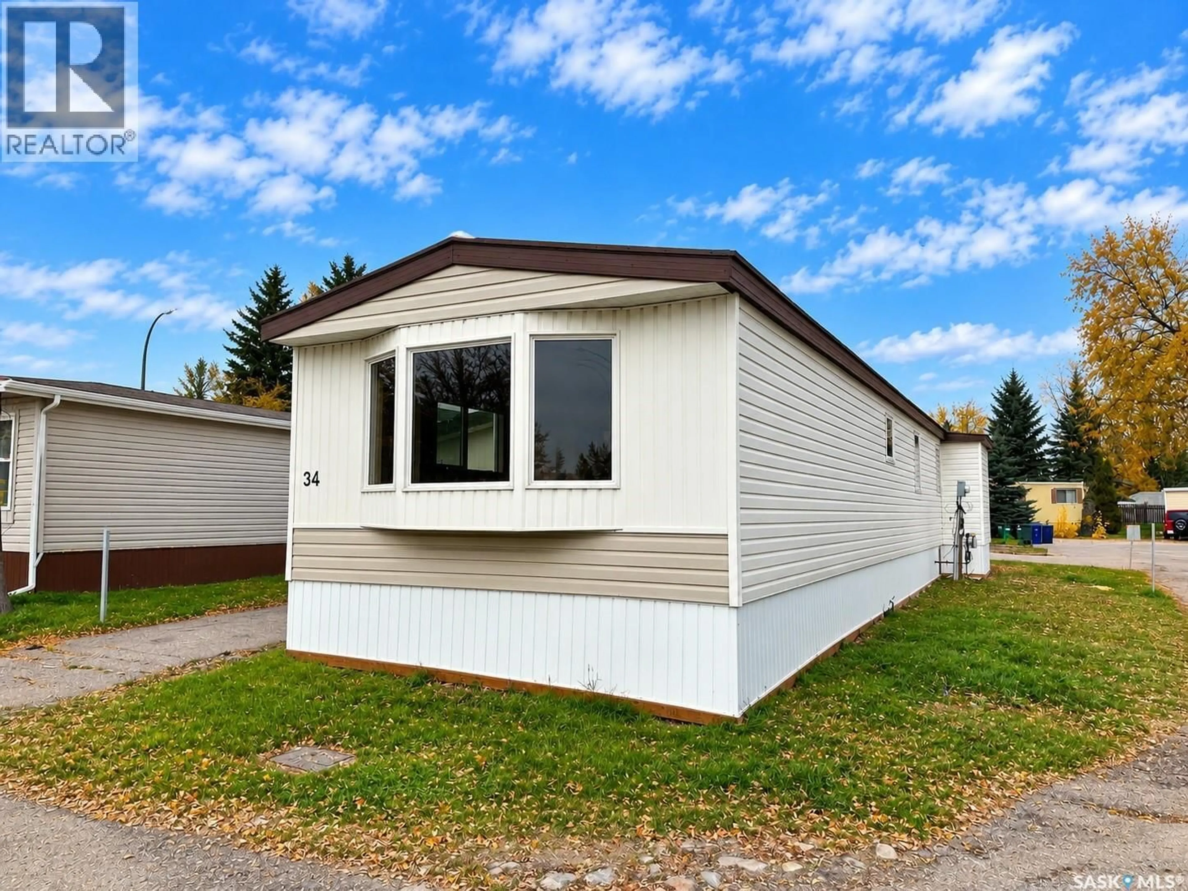 Home with vinyl exterior material, street for 1035 - 34 BOYCHUK DRIVE, Saskatoon Saskatchewan S7H5B2