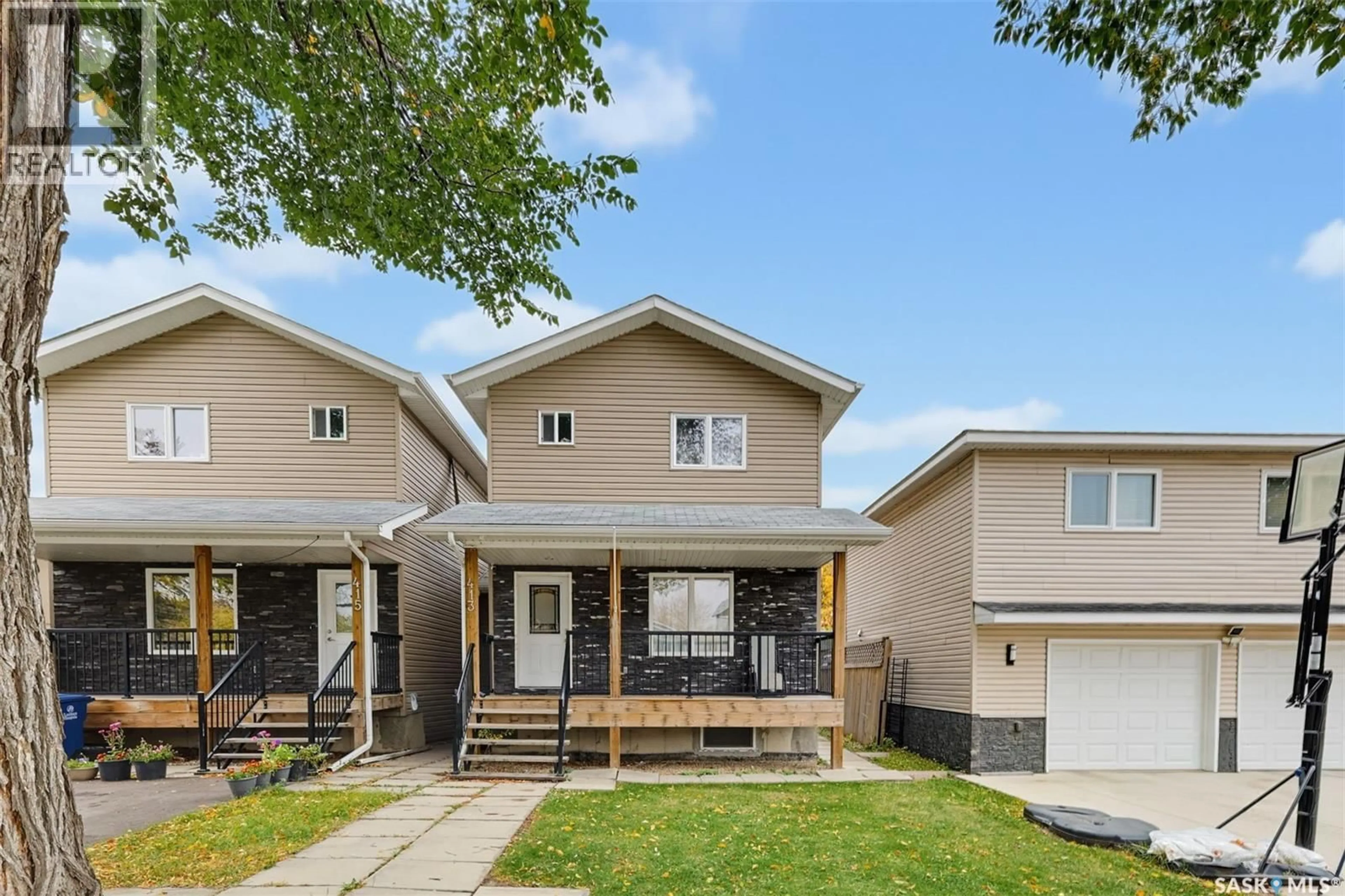 Home with vinyl exterior material, street for 413 X AVENUE, Saskatoon Saskatchewan S7M3H7