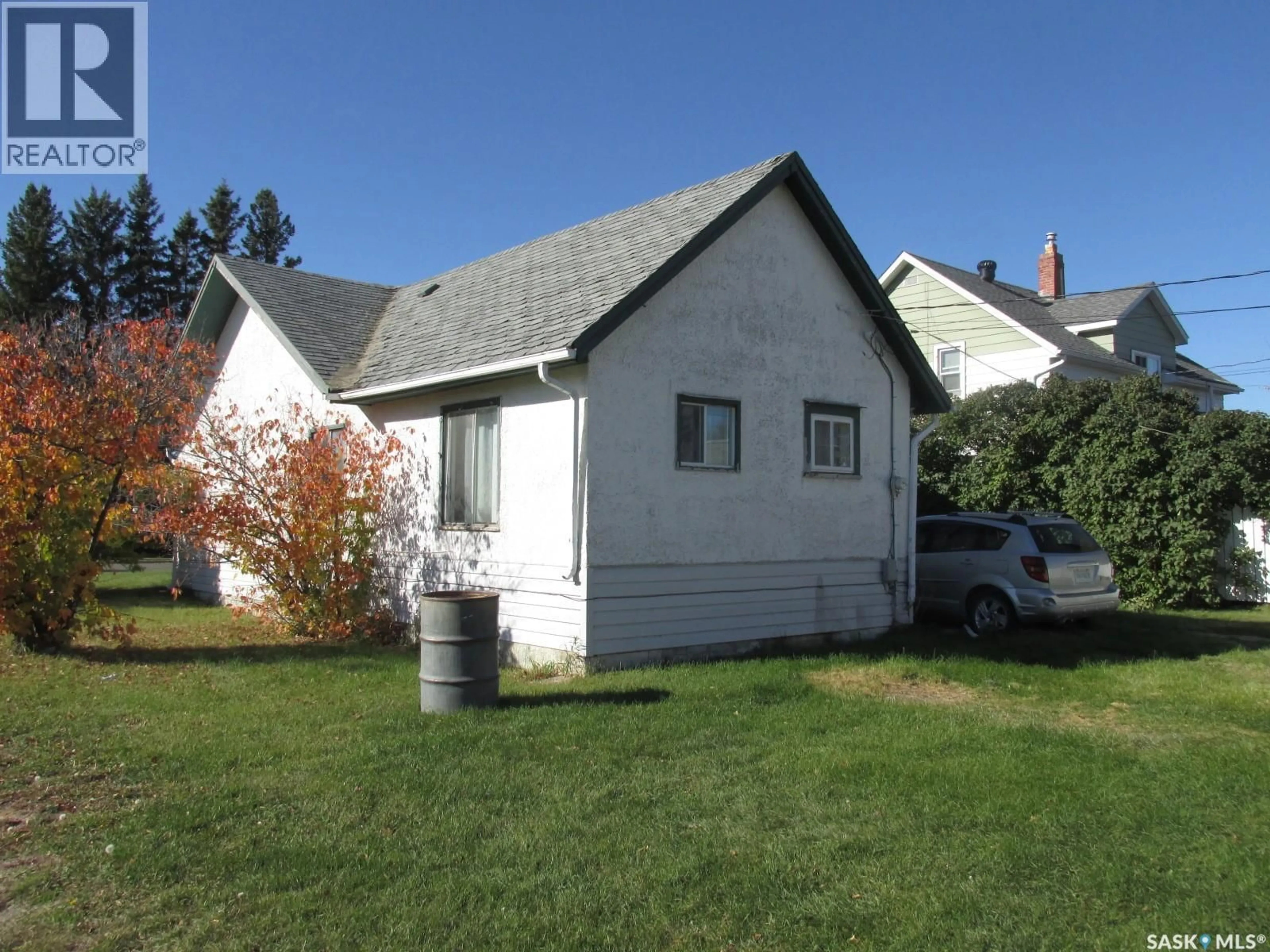 Home with vinyl exterior material, street for 303 2ND STREET, Nipawin Saskatchewan S0E1E0