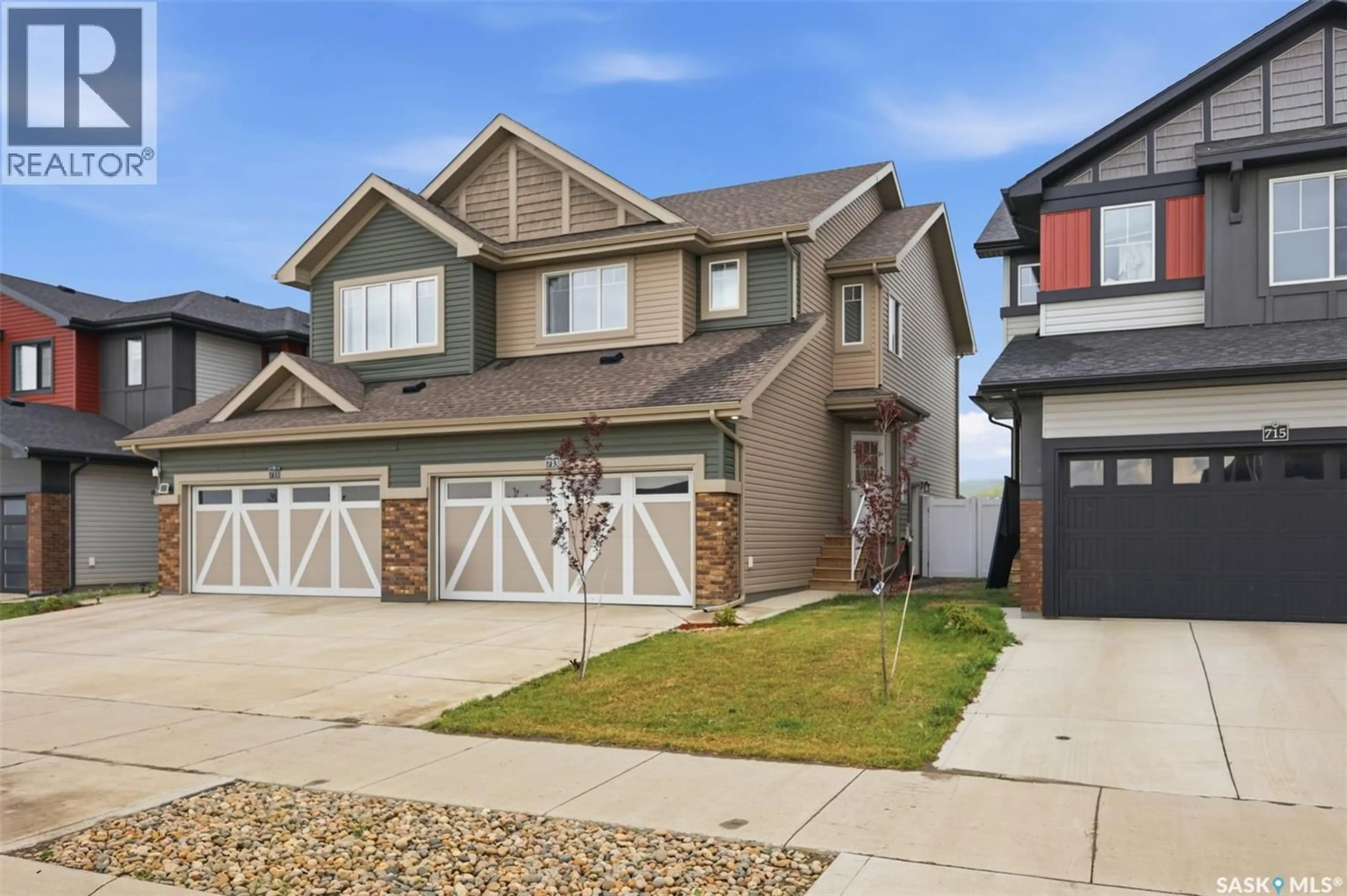 Home with vinyl exterior material, street for 713 BRIGHTON BOULEVARD, Saskatoon Saskatchewan S7V1P3