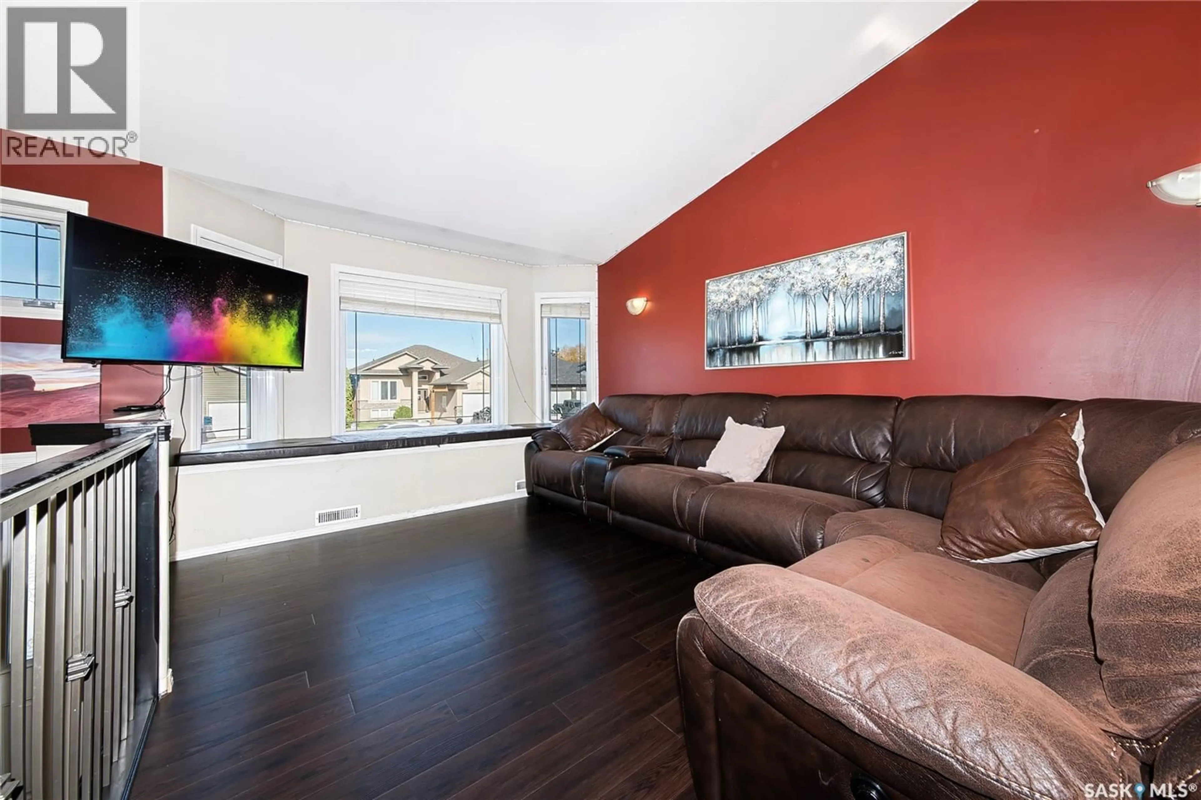 Living room with furniture, wood/laminate floor for 604 REGIER PLACE, Martensville Saskatchewan S0K0A2