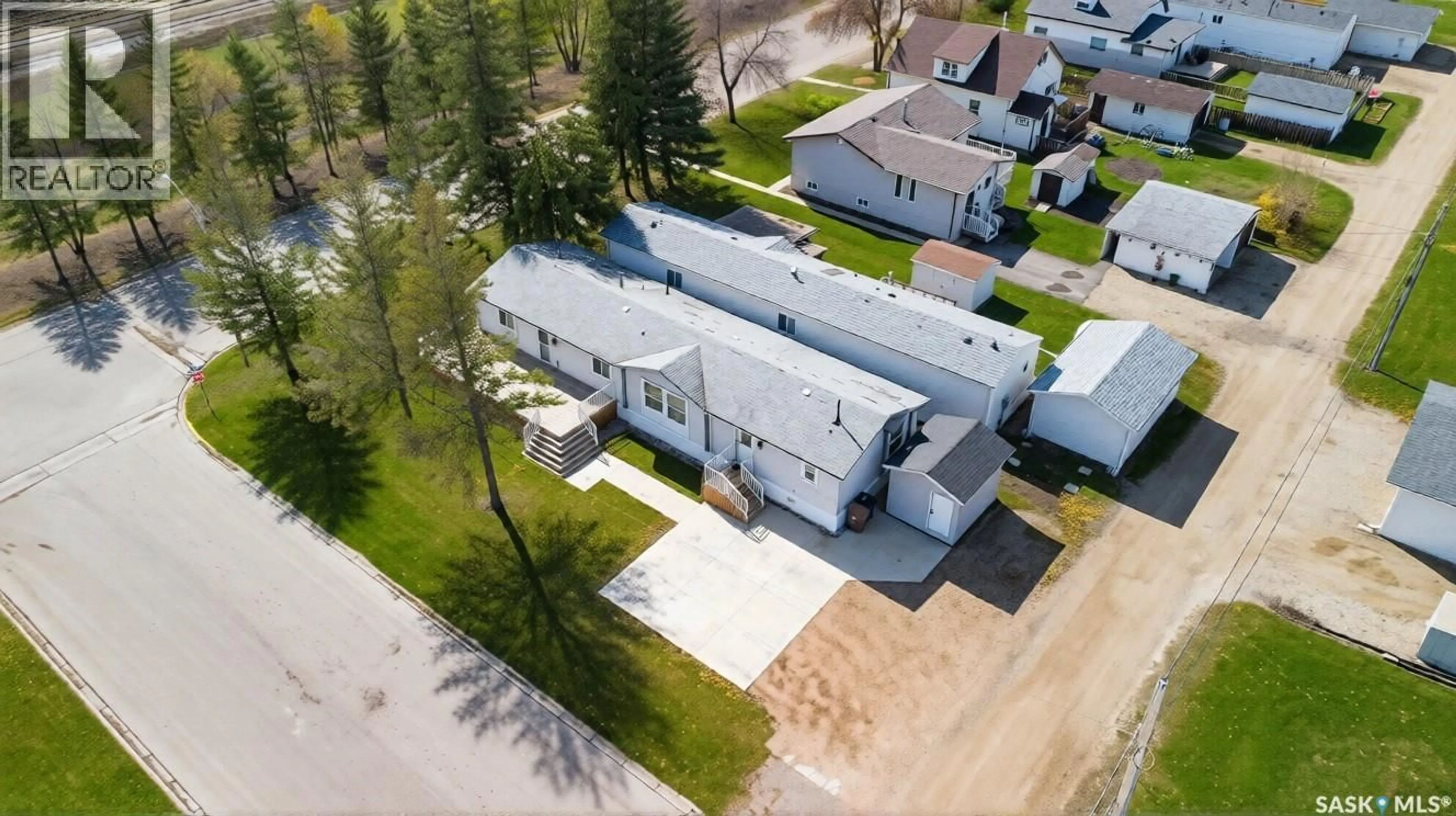 A pic from outside/outdoor area/front of a property/back of a property/a pic from drone, street for 119 RAILWAY AVENUE, Kinistino Saskatchewan S0J1H0