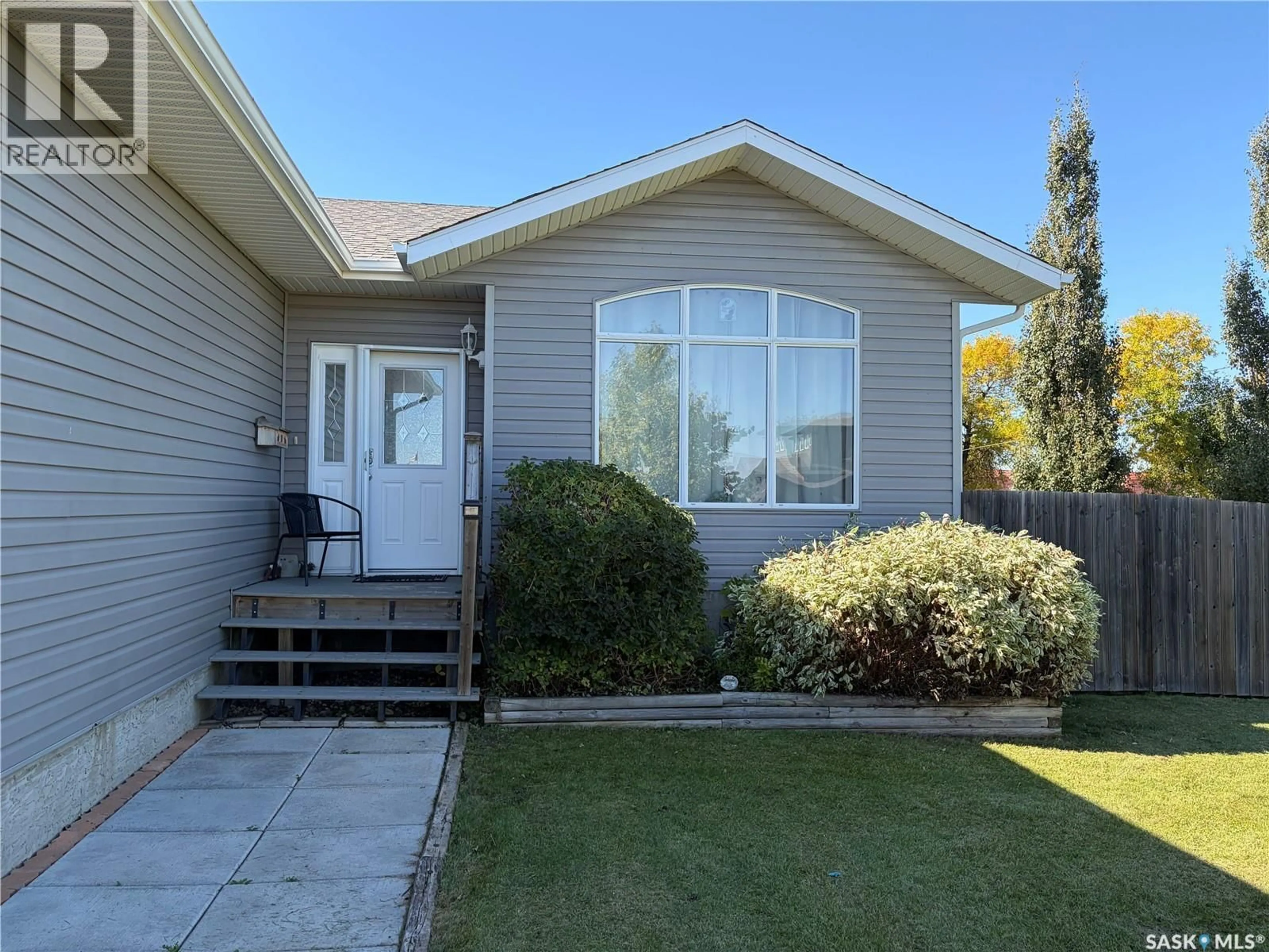 Home with vinyl exterior material, street for 306 GUEST COURT, Cudworth Saskatchewan S0K1B0