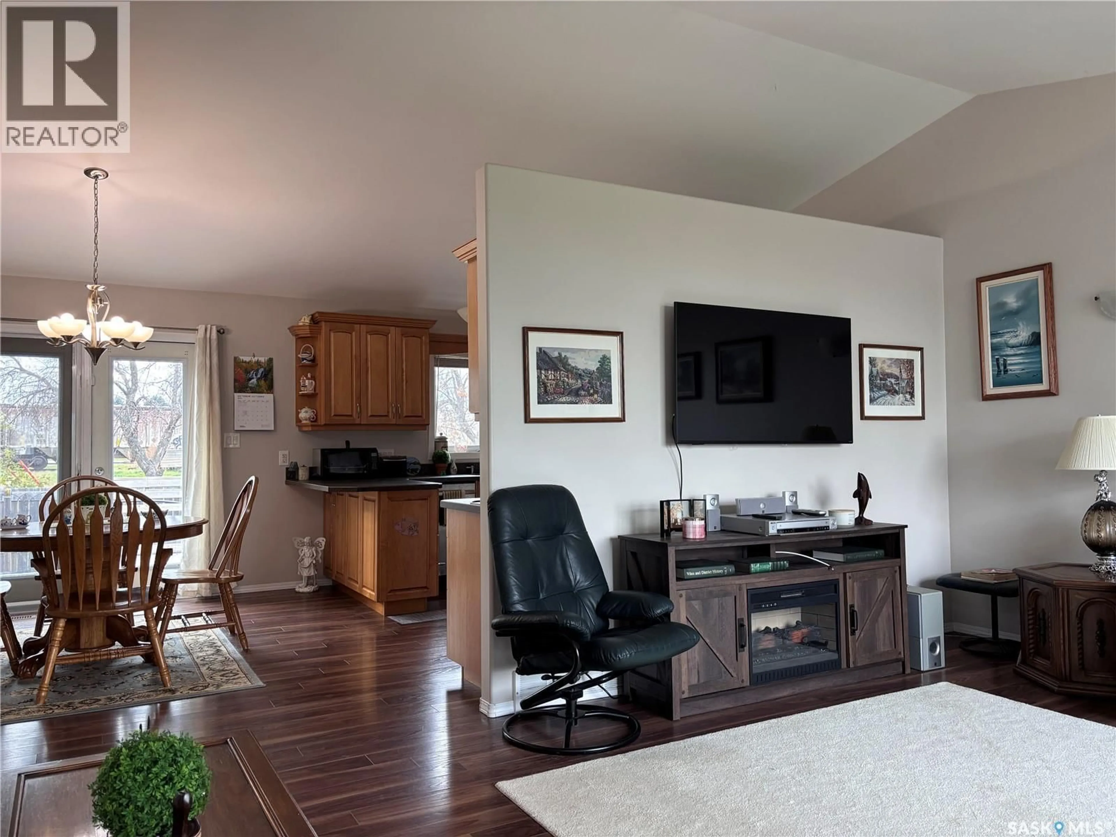 Living room with furniture, wood/laminate floor for 306 GUEST COURT, Cudworth Saskatchewan S0K1B0