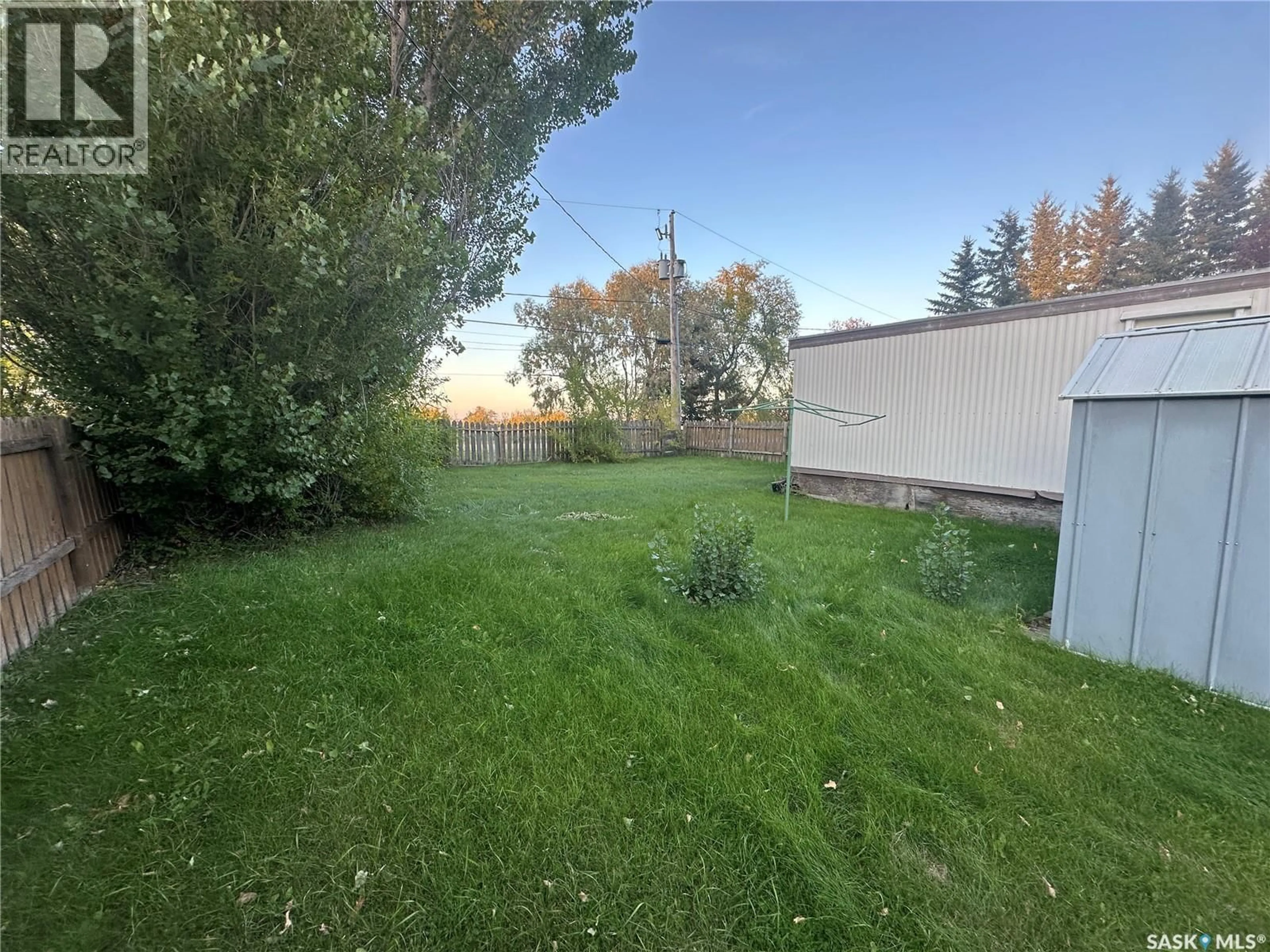 A pic from outside/outdoor area/front of a property/back of a property/a pic from drone, forest/trees view for E - 624 LITTLE QUILL AVENUE, Wynyard Saskatchewan S0A4T0