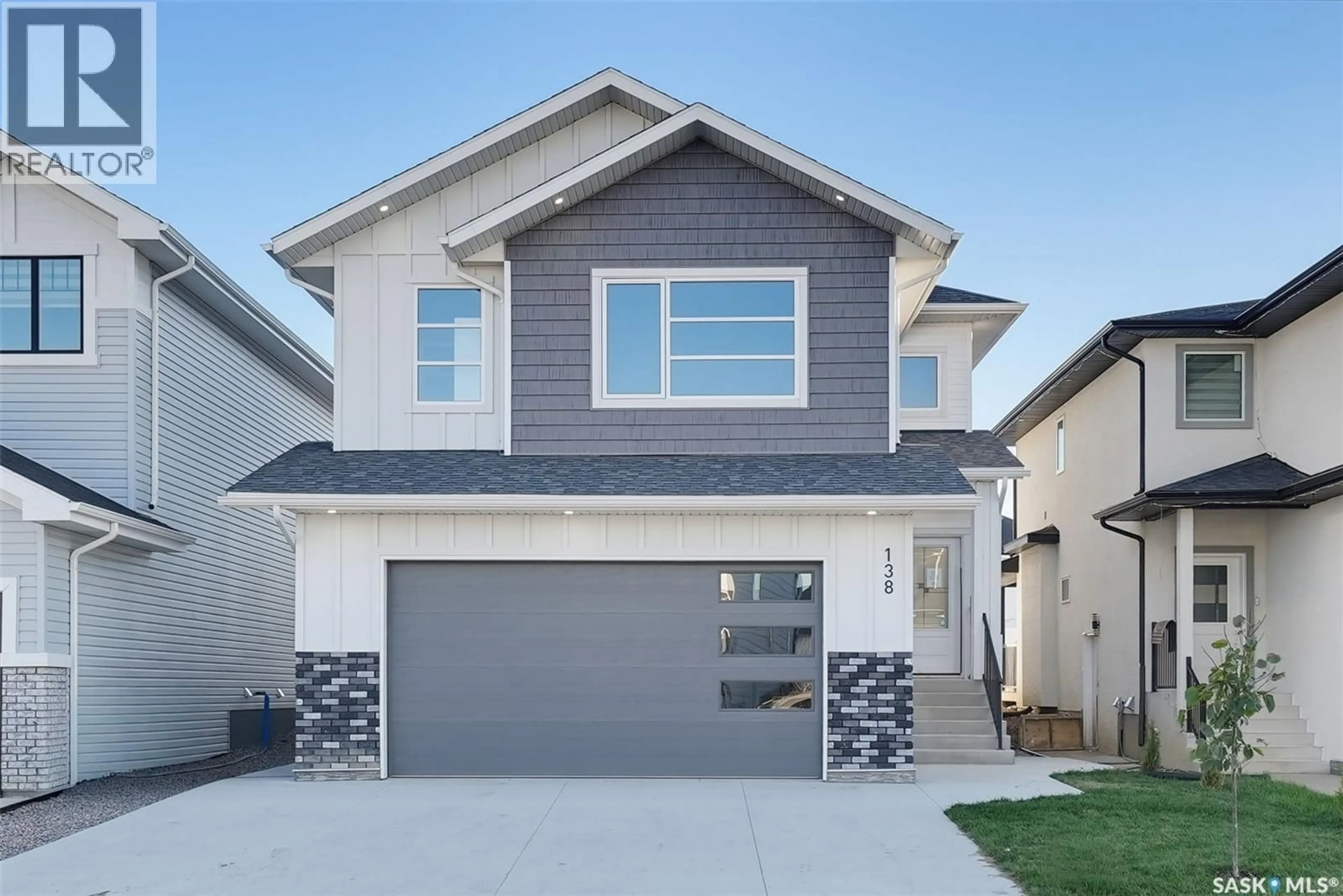 Home with vinyl exterior material, street for 138 SHARMA LANE, Saskatoon Saskatchewan S7W1L1