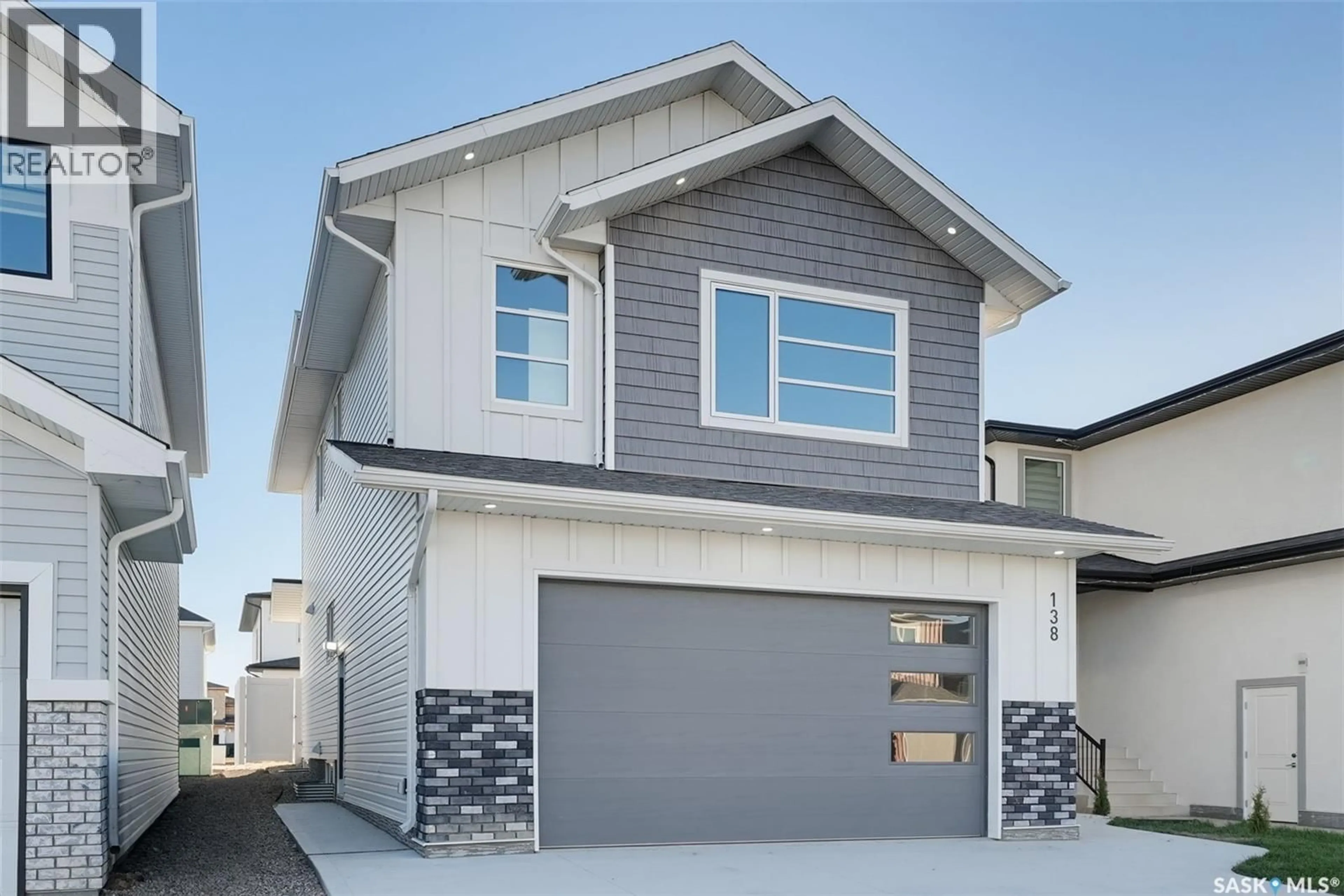 Home with vinyl exterior material, street for 138 SHARMA LANE, Saskatoon Saskatchewan S7W1L1