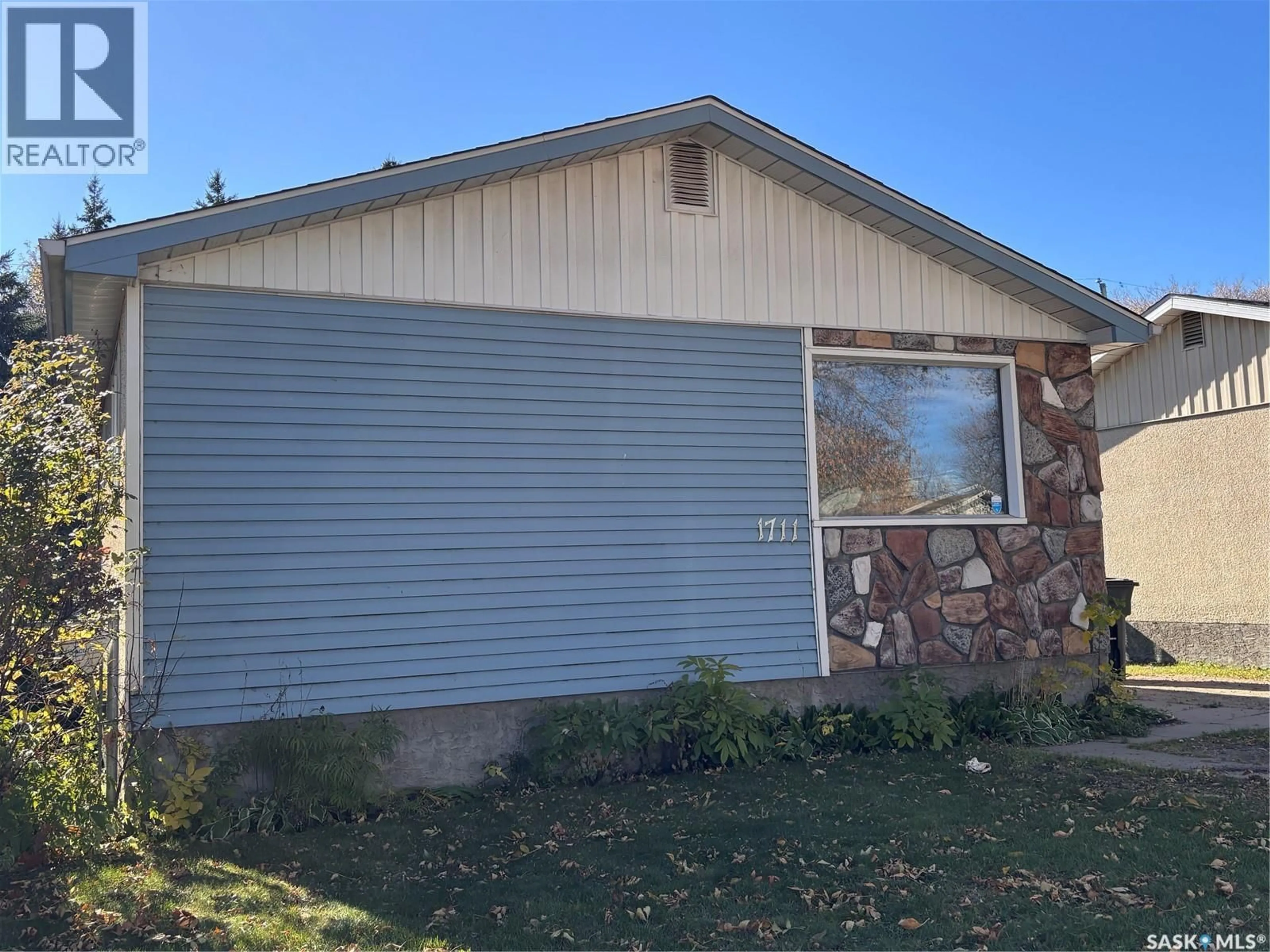 Home with vinyl exterior material, street for 1711 13TH STREET, Prince Albert Saskatchewan S6V3K2