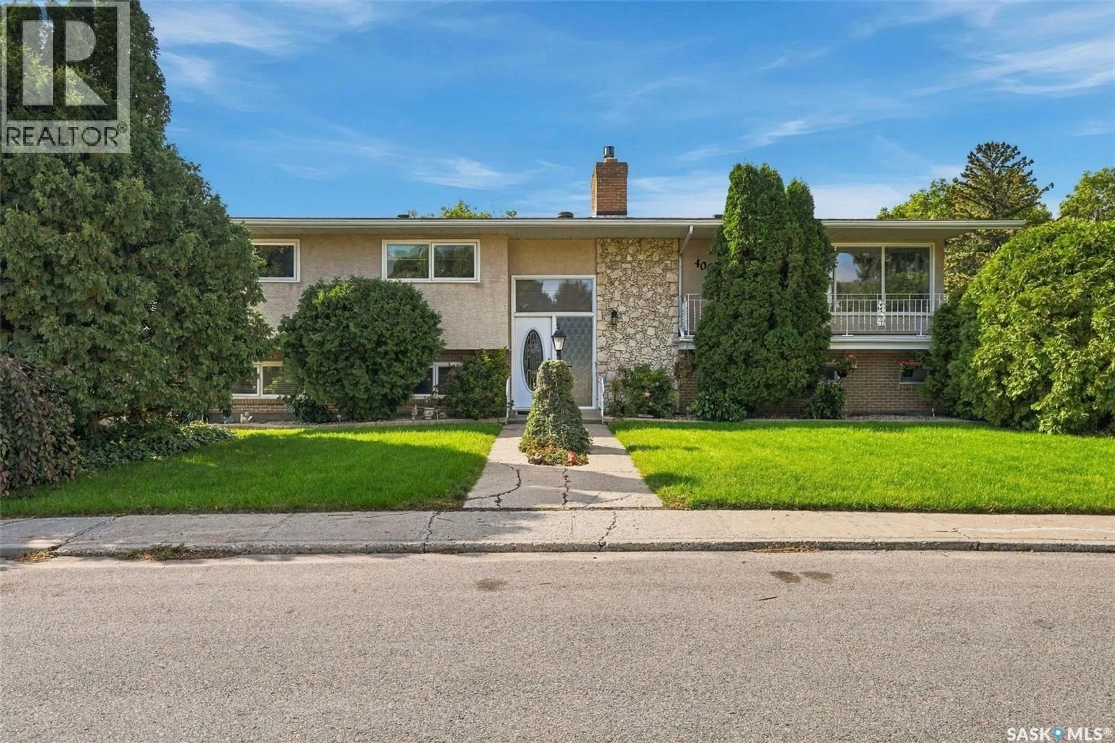 Home with brick exterior material, street for 4002 ELPHINSTONE STREET, Regina Saskatchewan S4S3K9