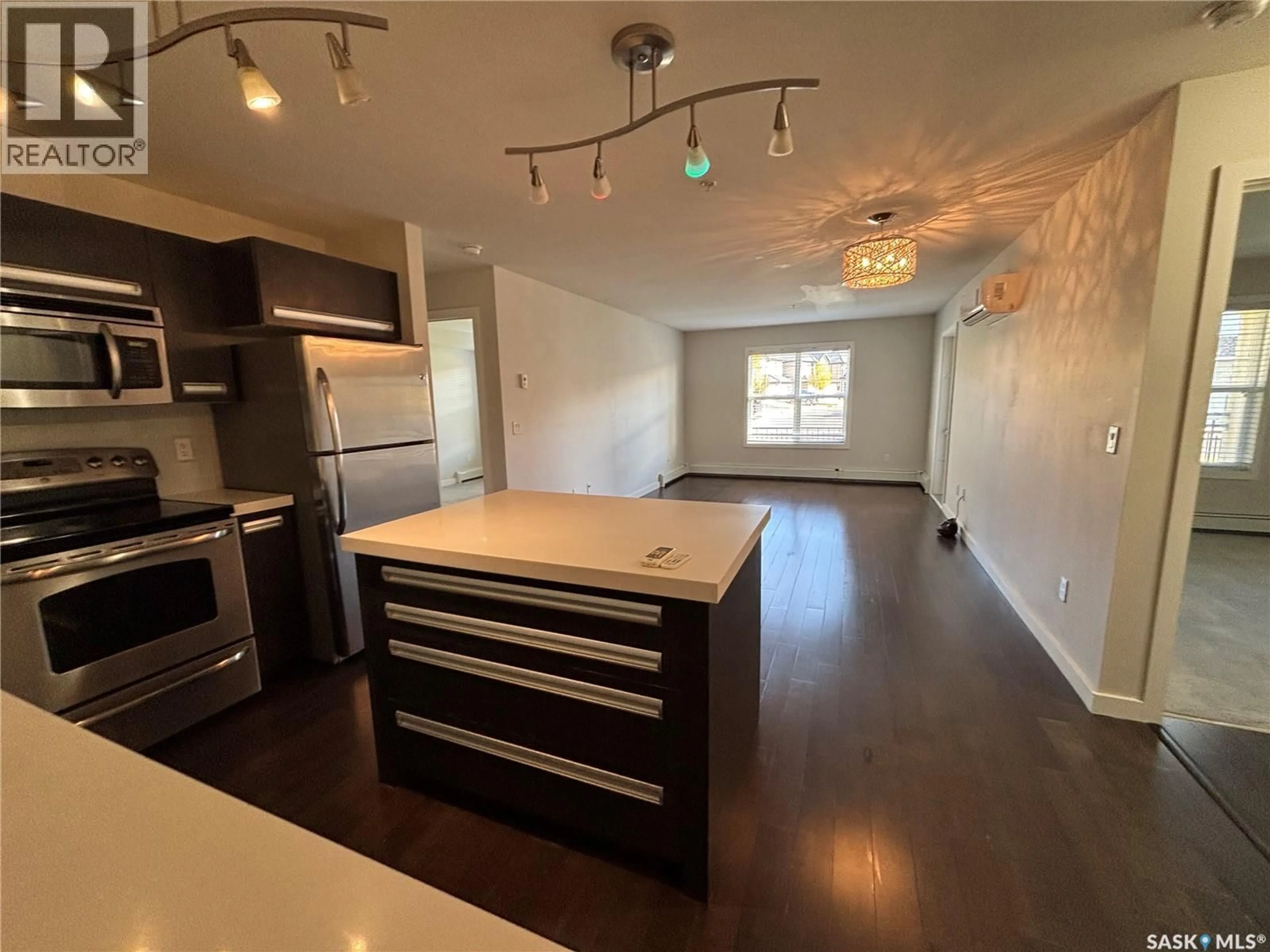 Open concept kitchen, wood/laminate floor for 211 - 105 LEDINGHAM STREET, Saskatoon Saskatchewan S7V0C5
