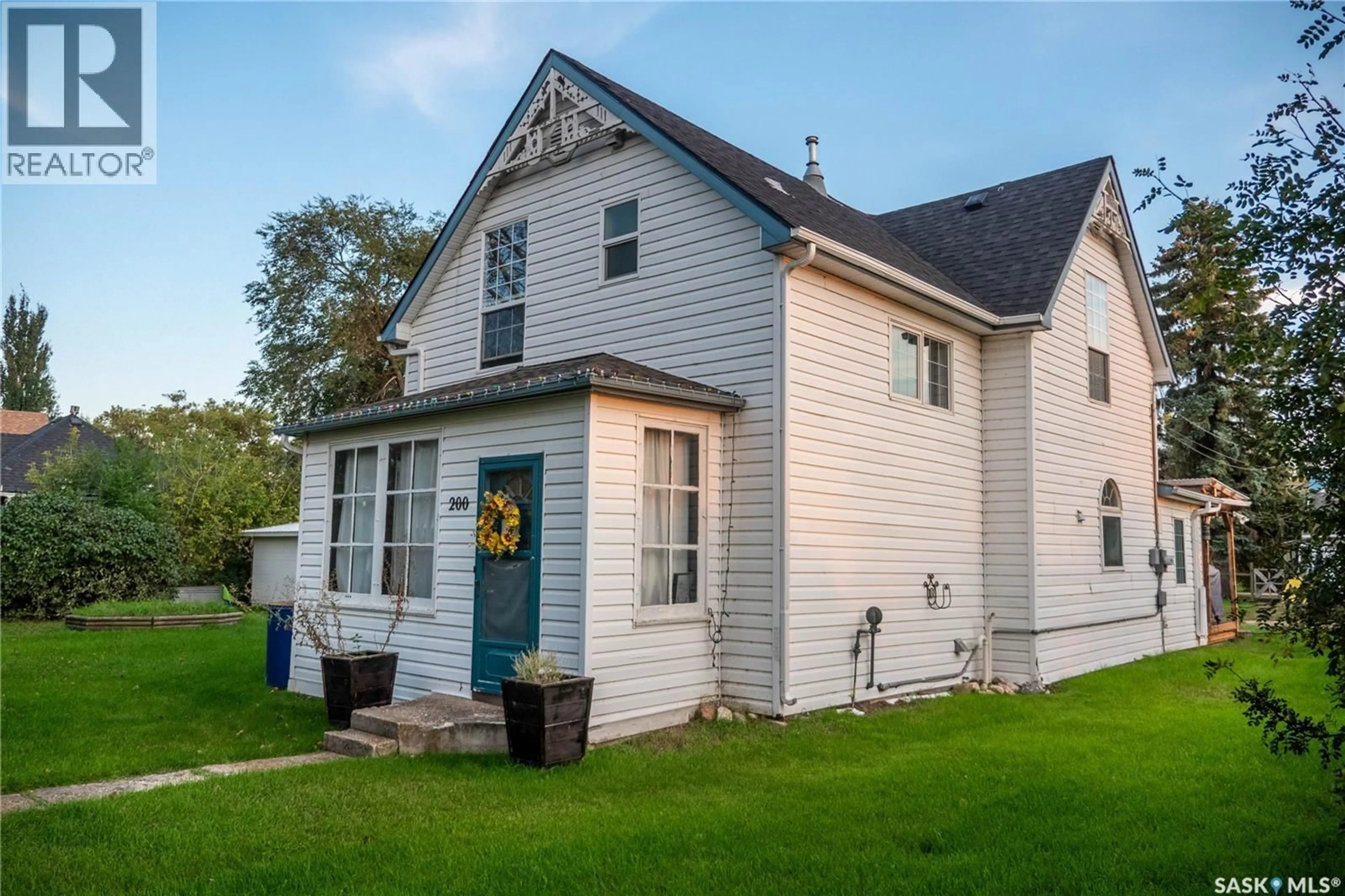 Home with vinyl exterior material, street for 200 2ND STREET, Dundurn Saskatchewan S0K1K0