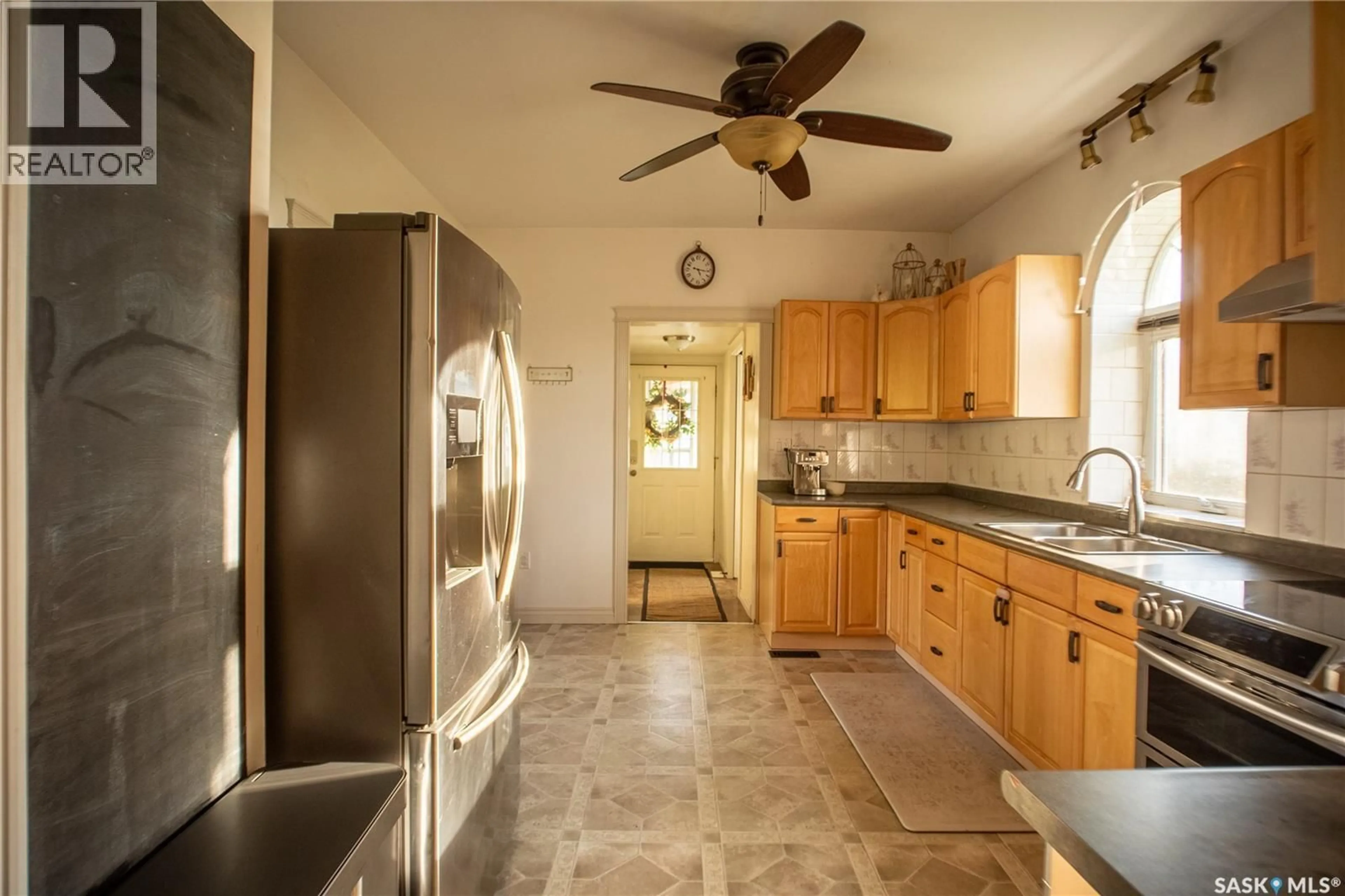 Kitchen with laundary machines, ceramic/tile floor for 200 2ND STREET, Dundurn Saskatchewan S0K1K0
